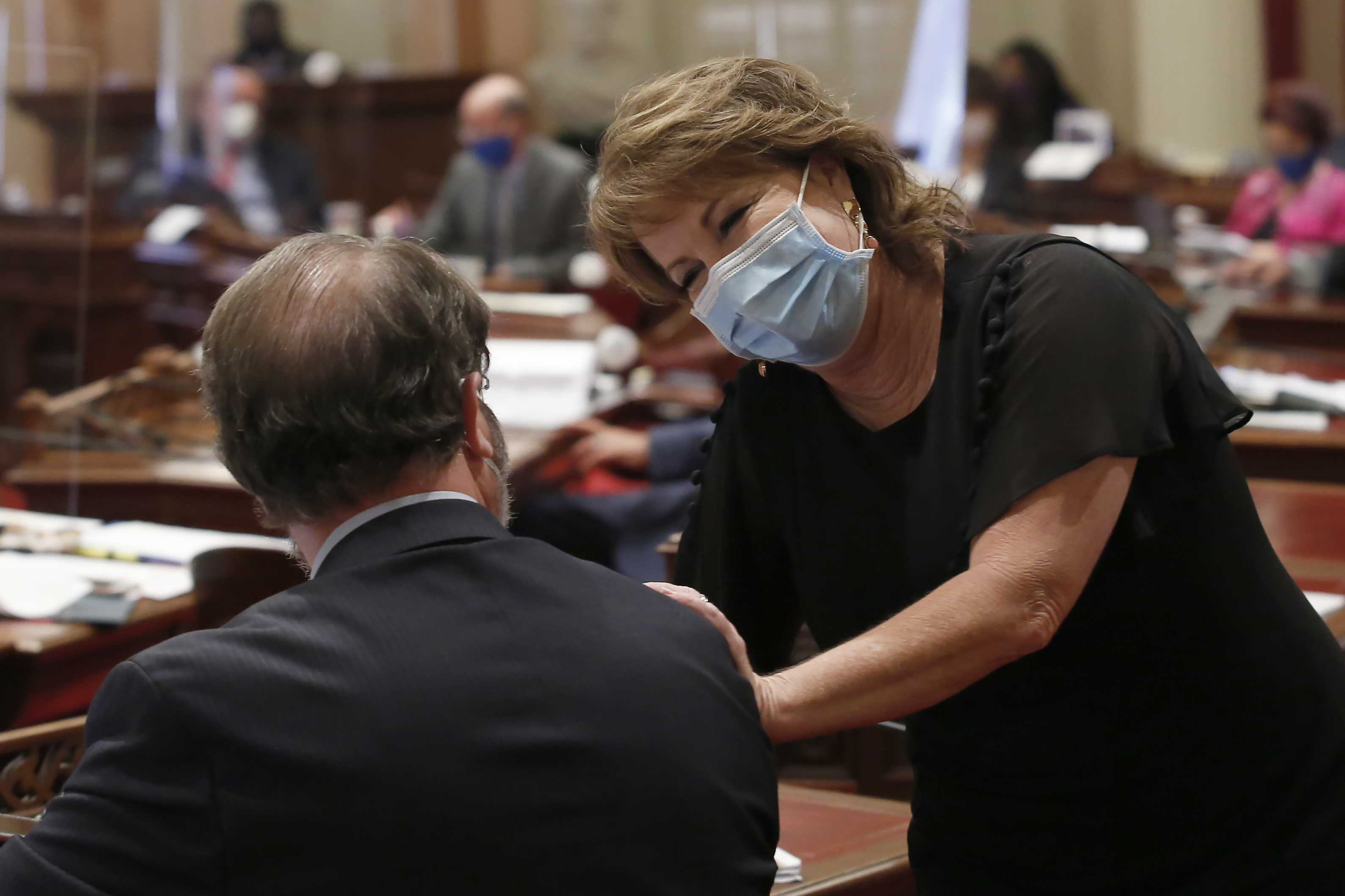 In this Thursday June 25, 2020 file photo State Senate Republican Leader Shannon Grove, of Bakersfield, talks with Sen. John Moorlach, R-Costa Mesa before at the Capitol, in Sacramento. (AP Photo/Rich Pedroncelli, File)