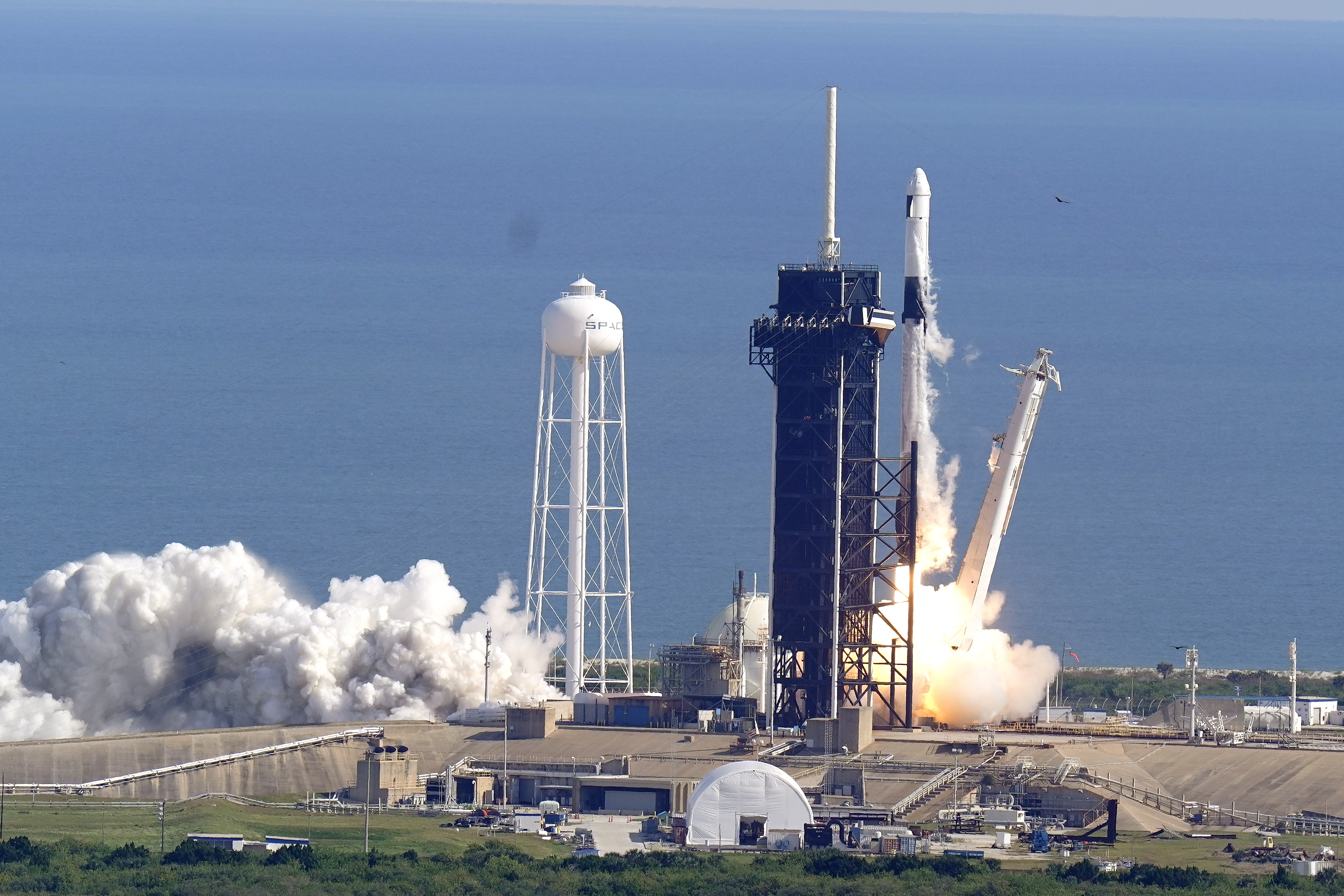 A SpaceX Falcon 9 rocket on a resupply mission to the International Space Station lifts off from pad 39A at the Kennedy Space Center in Cape Canaveral, Fla., Sunday, Dec. 6, 2020. (AP Photo/John Raoux)