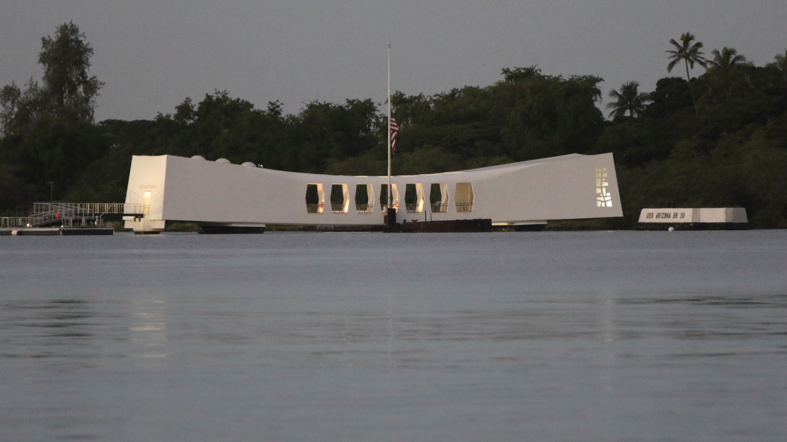 The USS Arizona Memorial is seen ahead of a ceremony marking the anniversary of the Japanese attack on Monday, Dec. 7, 2020, in Pearl Harbor, Hawaii. Officials gathered in Pearl Harbor to remember those killed in the 1941 Japanese attack, but public health measures adopted because of the coronavirus pandemic meant no survivors were present. The military broadcast video of the ceremony live online for survivors and members of the public to watch from afar. A moment of silence was held at 7:55 a.m., the same time the attack began 79 years ago. (AP Photo/Caleb Jones, Pool)