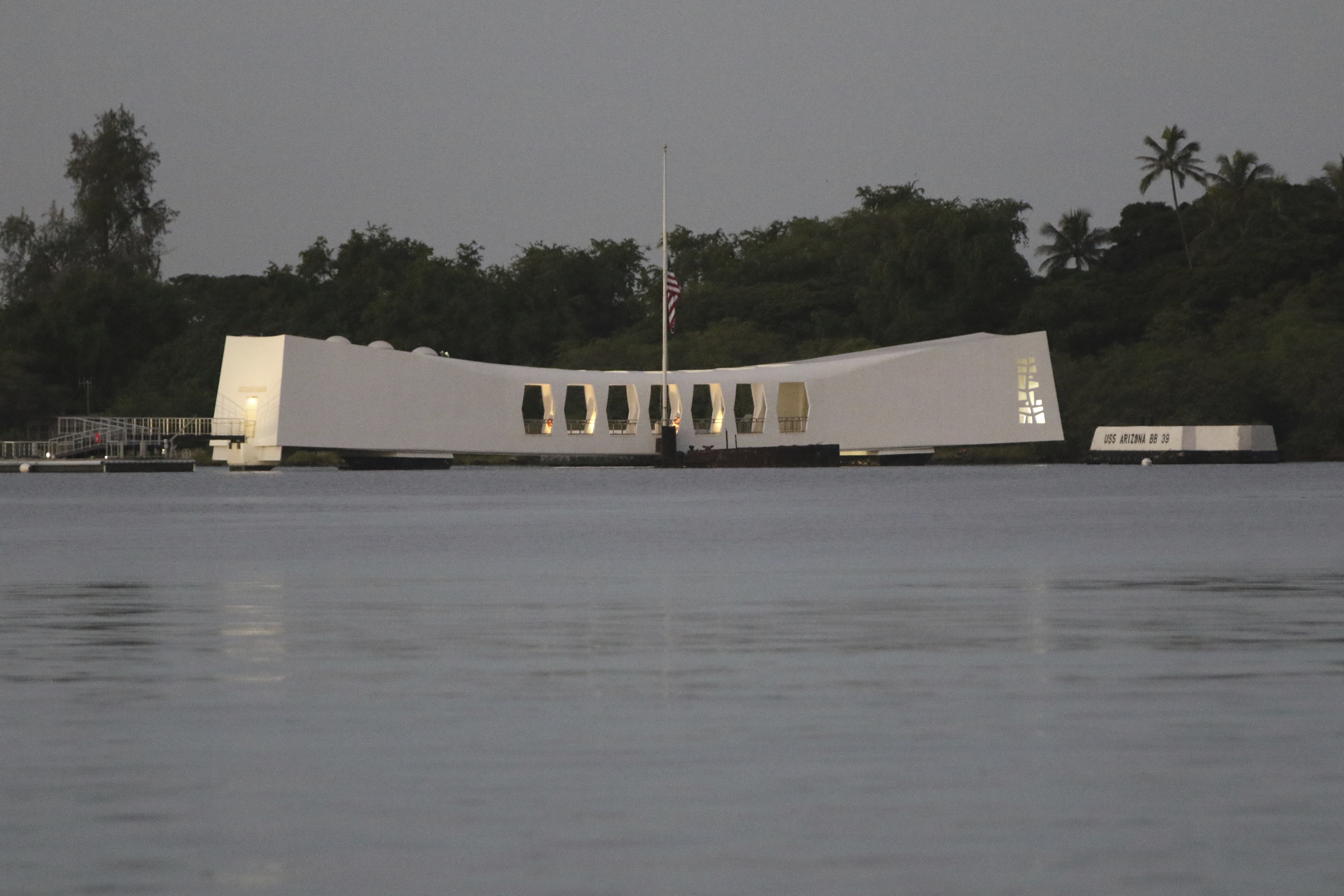 The USS Arizona Memorial is seen ahead of a ceremony marking the anniversary of the Japanese attack on Monday, Dec. 7, 2020, in Pearl Harbor, Hawaii. Officials gathered in Pearl Harbor to remember those killed in the 1941 Japanese attack, but public health measures adopted because of the coronavirus pandemic meant no survivors were present. The military broadcast video of the ceremony live online for survivors and members of the public to watch from afar. A moment of silence was held at 7:55 a.m., the same time the attack began 79 years ago. (AP Photo/Caleb Jones, Pool)