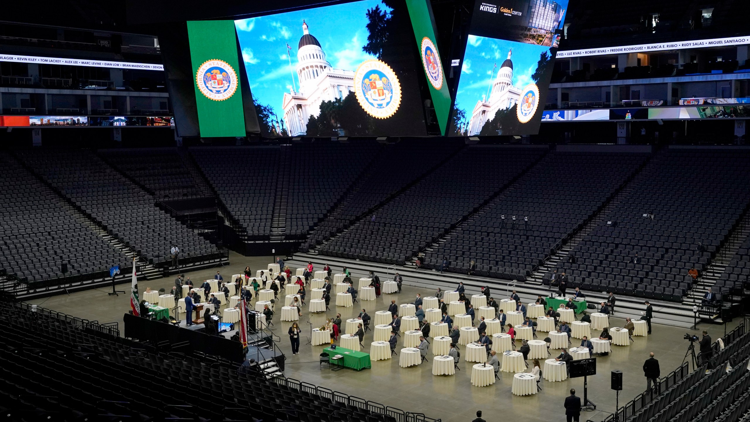 Members of the California State Assembly gathered on the floor of the Golden 1 Center for their organizational session in Sacramento, Calif., on Dec. 7, 2020. In order to follow social distancing guidelines, the Assembly session was held at the home of the Sacramento Kings. (AP Photo/Rich Pedroncelli)