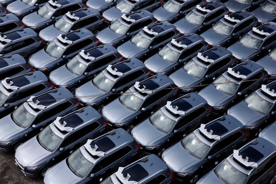 A parking lot full of Uber self-driving Volvos is seen in Pittsburgh on March 20, 2020. (Gene J. Puskar / Associated Press)