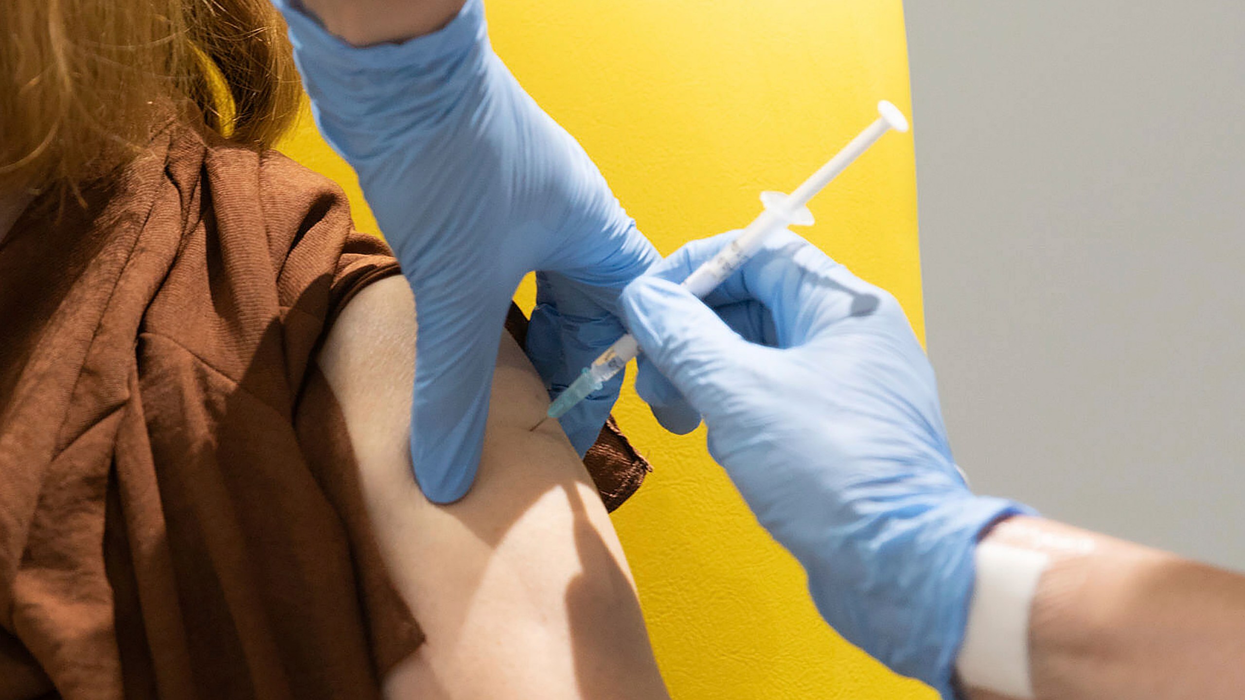 In this undated file photo issued by the University of Oxford, a volunteer is administered the coronavirus vaccine developed by AstraZeneca and Oxford University, in Oxford, England. (John Cairns/University of Oxford via AP, File)