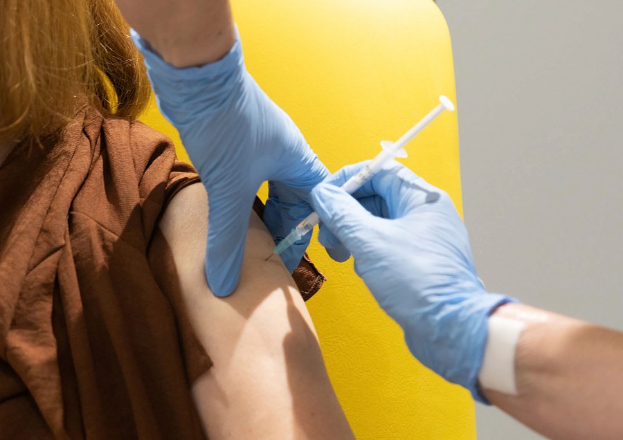 In this undated file photo issued by the University of Oxford, a volunteer is administered the coronavirus vaccine developed by AstraZeneca and Oxford University, in Oxford, England. (John Cairns/University of Oxford via AP, File)