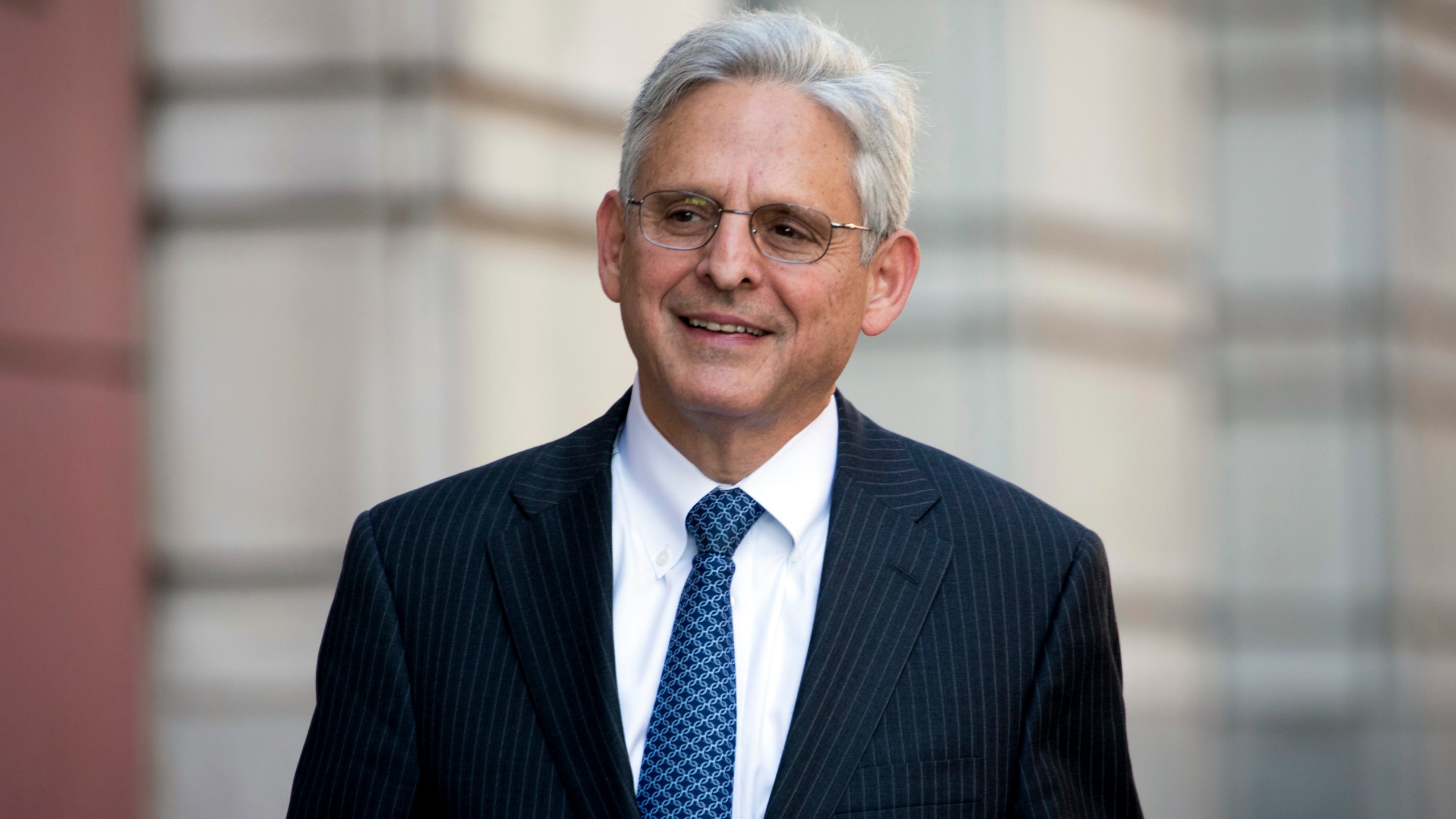 Former Supreme Court nominee Merrick Garland walks into Federal District Court in Washington on Nov. 17, 2017. (Andrew Harnik / Associated Press)