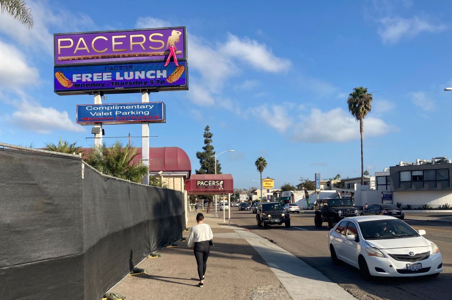 A pedestrian walks past Pacers Showgirls International in San Diego, on Thursday, Dec. 10, 2020. (Elliot Spagat/AP Photo)