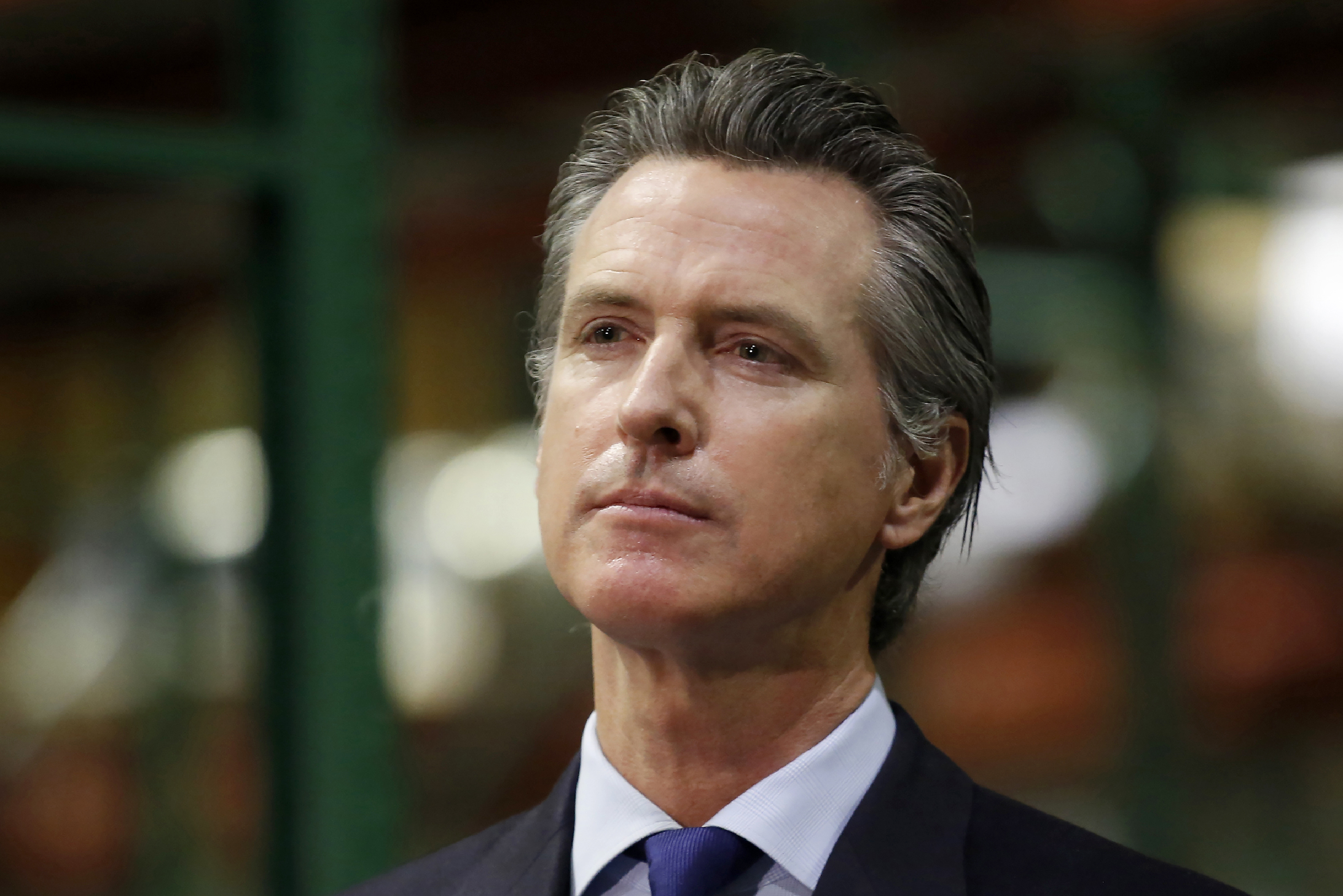 In this June 26, 2020, file photo, California Gov. Gavin Newsom listens to a reporter's question during a news conference in Rancho Cordova, Calif. (AP Photo/Rich Pedroncelli, Pool, File)