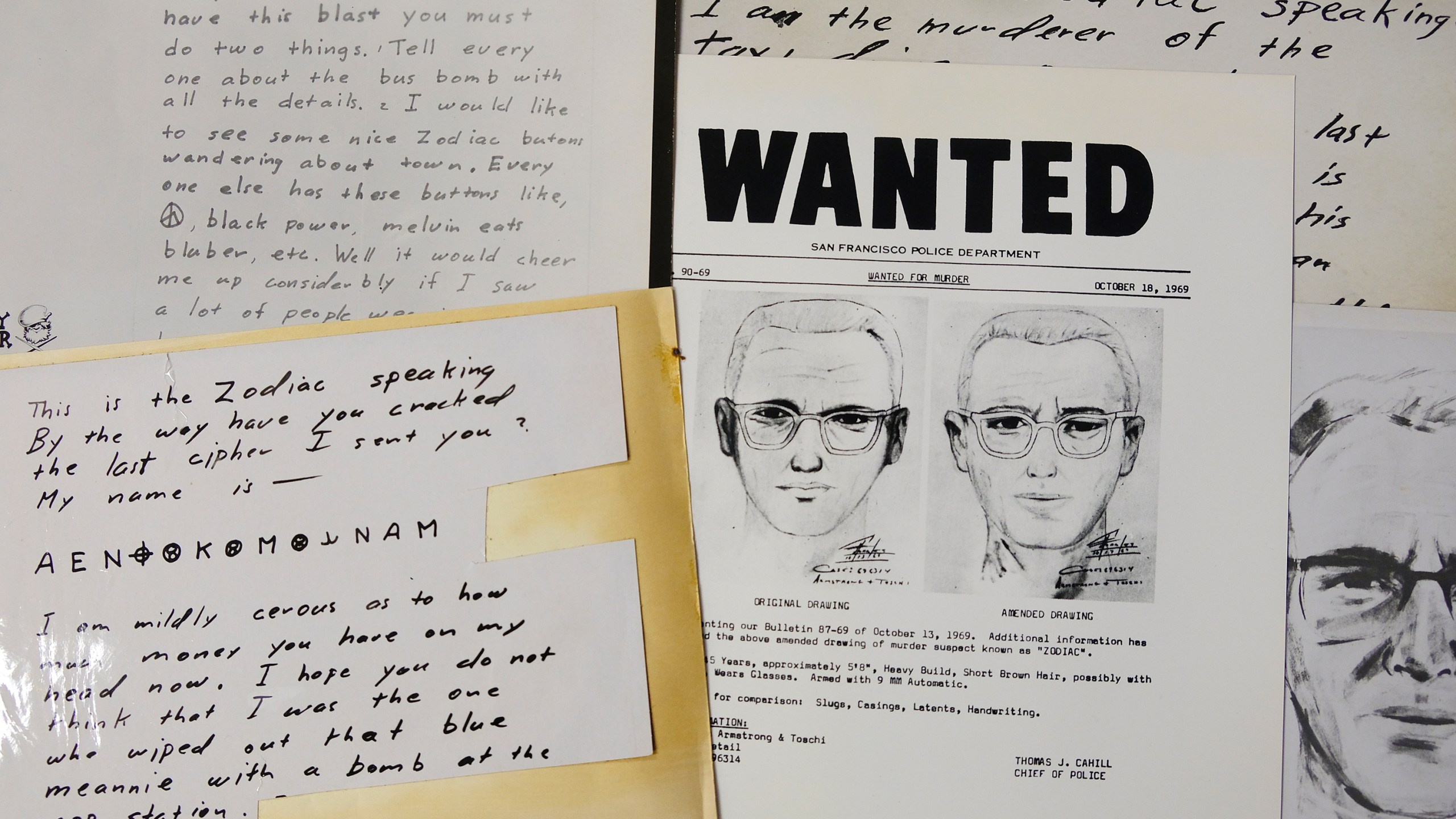 In this May 3, 2018, file photo, a San Francisco Police Department wanted bulletin and copies of letters sent to the San Francisco Chronicle by a man who called himself Zodiac are displayed in San Francisco. A coded letter mailed to a San Francisco newspaper by the Zodiac serial killer in 1969 has been deciphered by a team of amateur sleuths from the United States, Australia and Belgium, the San Francisco Chronicle reported Friday, Dec. 11, 2020. (AP Photo/Eric Risberg, File)