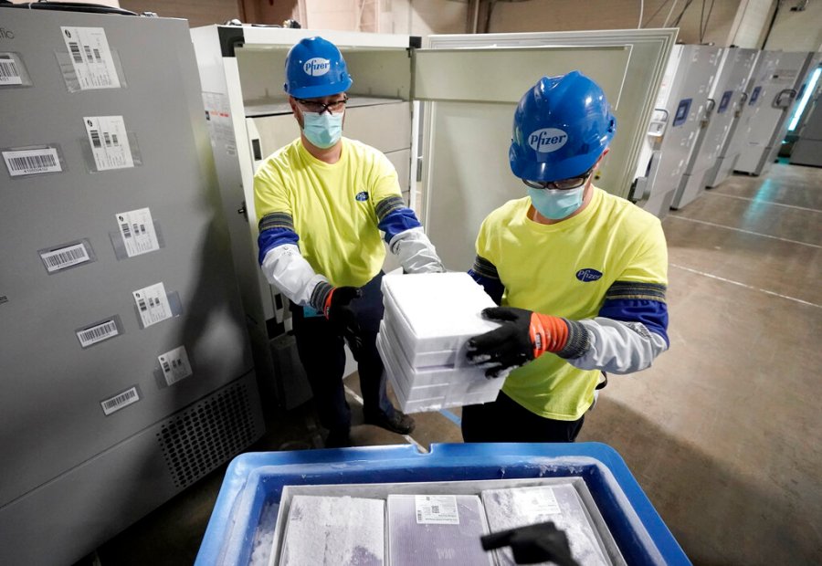 Boxes containing the Pfizer-BioNTech COVID-19 vaccine are prepared to be shipped at the Pfizer Global Supply Kalamazoo manufacturing plant in Portage, Mich. on Dec. 13, 2020. (AP Photo/Morry Gash, Pool)