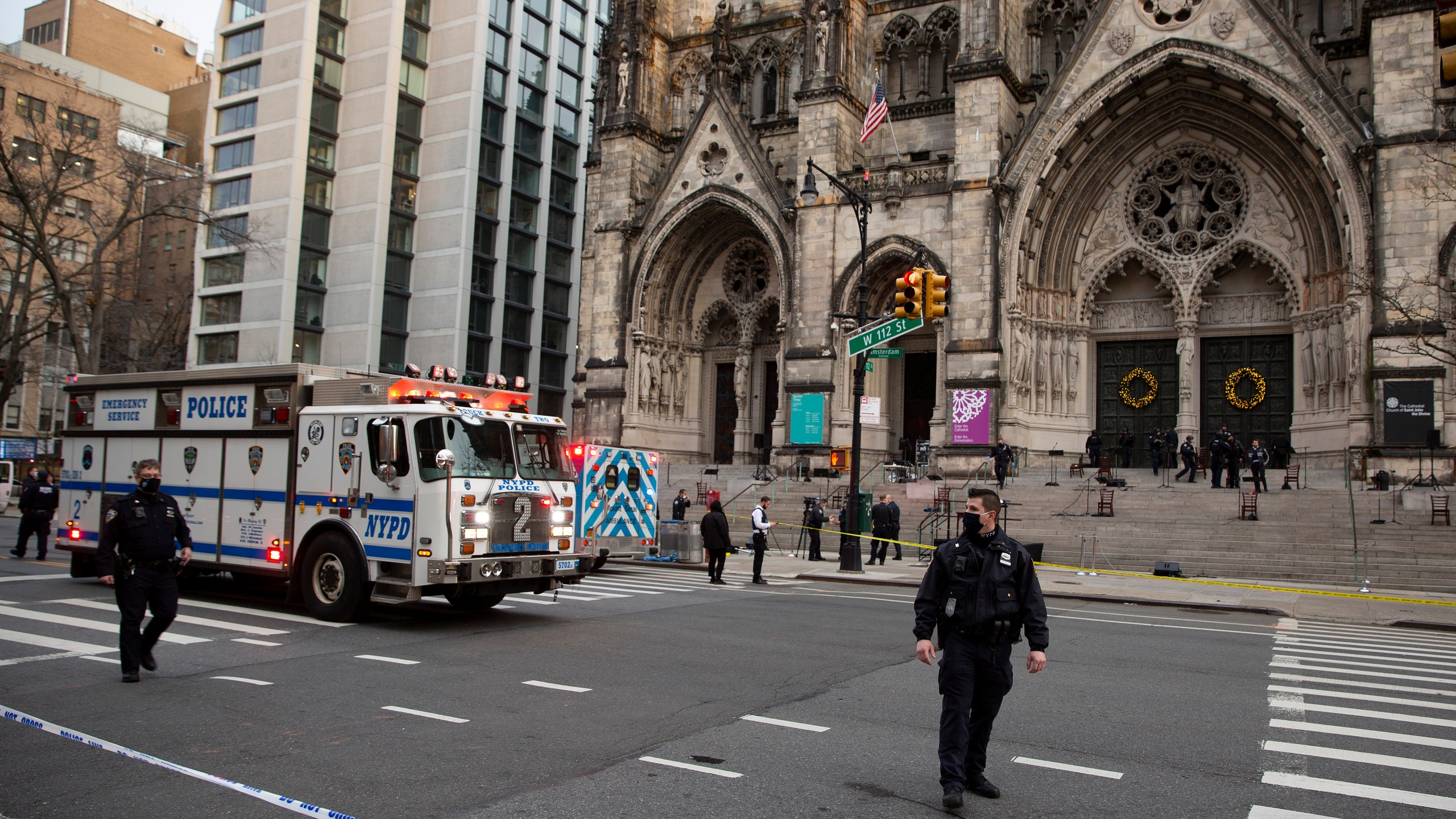 New York police officers block off the scene of a shooting at the Cathedral Church of St. John the Divine, Sunday, Dec. 13, 2020, in New York. (Ted Shaffrey/AP Photo)