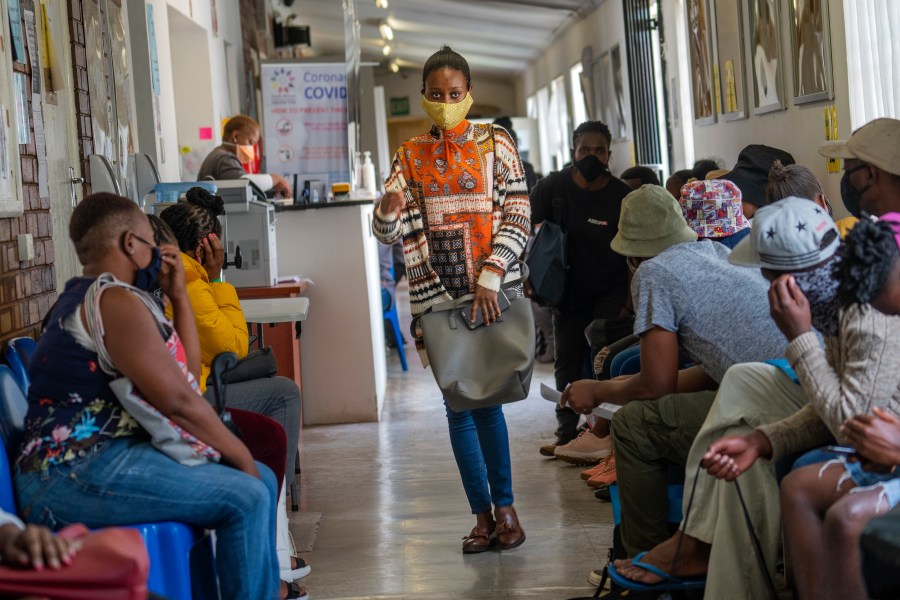 Volunteers wait to be checked at a vaccine trial facility for AstraZeneca at Soweto's Chris Sani Baragwanath Hospital outside Johannesburg, South Africa on Nov. 30, 2020. (AP Photo/Jerome Delay)