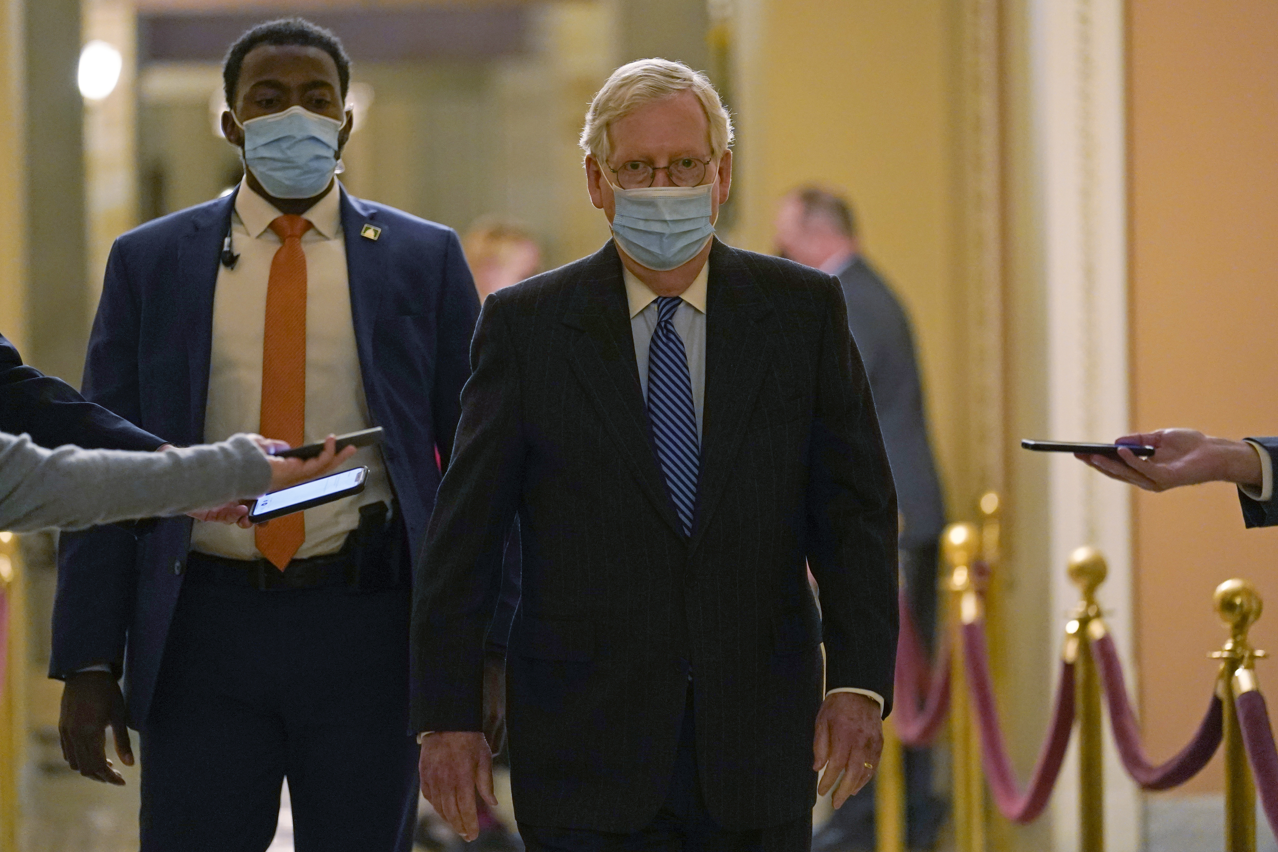 Senate Majority Leader Mitch McConnell of Ky., walks past reporters on Capitol Hill in Washington, Tuesday, Dec. 15, 2020. (Susan Walsh/AP Photo)