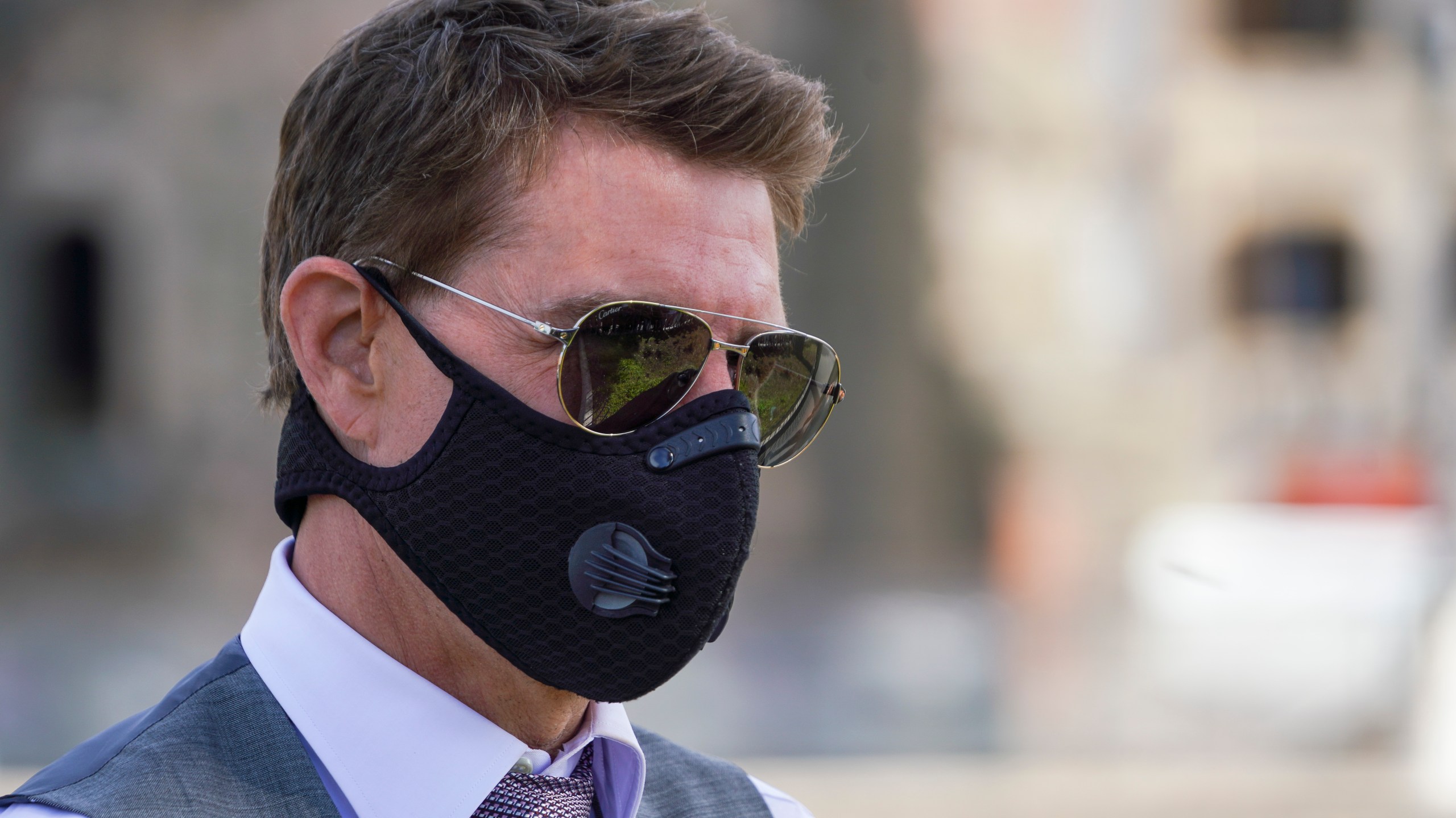 n this Tuesday, Oct. 13, 2020, file photo, actor Tom Cruise wears a face mask to prevent the spread of COVID-19 as he greets fans during a break from shooting Mission Impossible 7, along Rome's Fori Imperiali avenue. (AP Photo/Andrew Medichini, file)