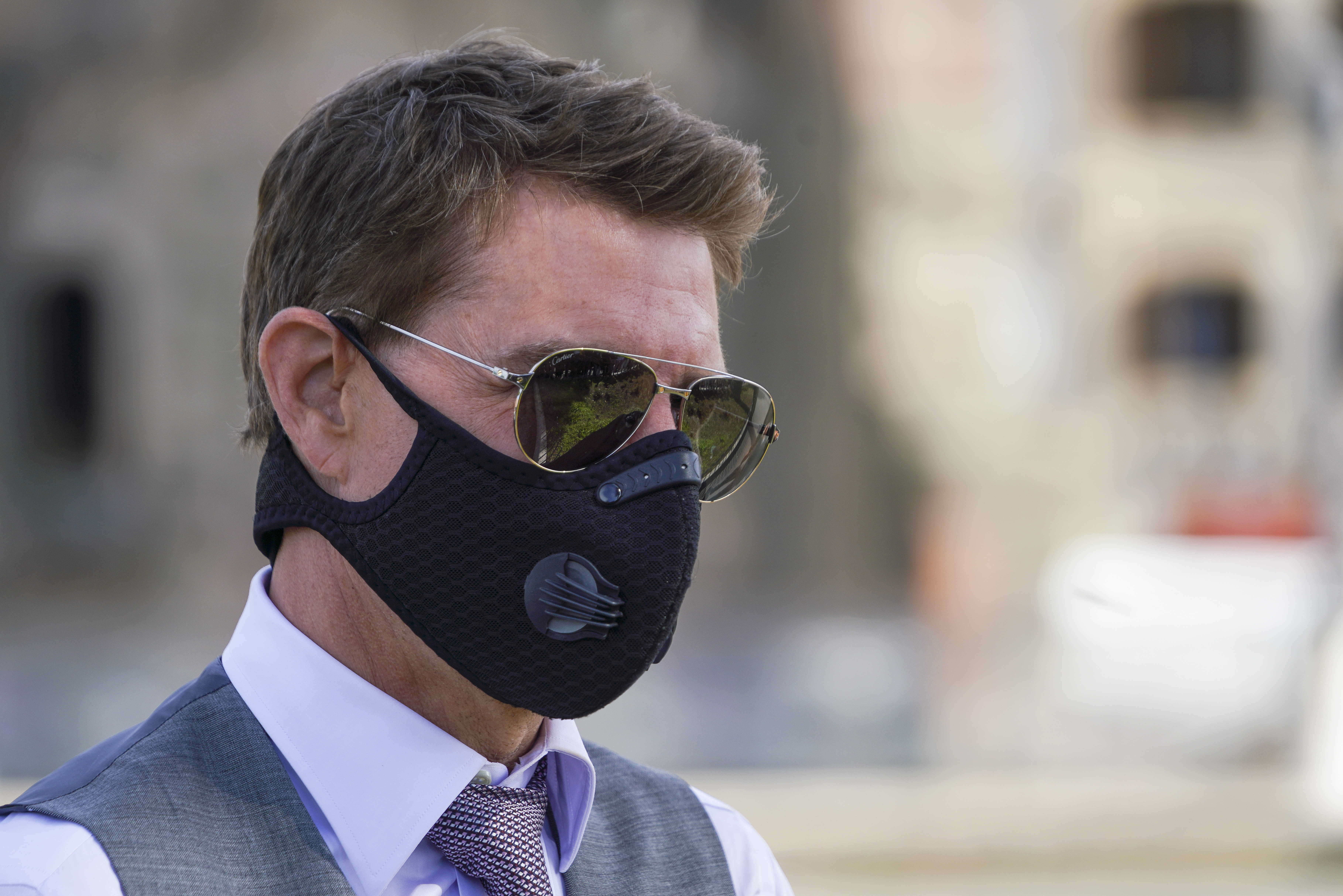 n this Tuesday, Oct. 13, 2020, file photo, actor Tom Cruise wears a face mask to prevent the spread of COVID-19 as he greets fans during a break from shooting Mission Impossible 7, along Rome's Fori Imperiali avenue. (AP Photo/Andrew Medichini, file)