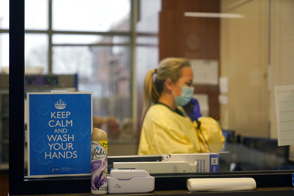 In this Nov. 24, 2020, file photo, registered nurse Chrissie Burkhiser works in the emergency room at Scotland County Hospital in Memphis, Mo. (AP Photo/Jeff Roberson, File)