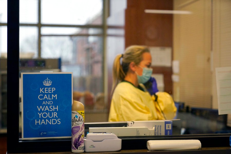 In this Nov. 24, 2020, file photo, registered nurse Chrissie Burkhiser works in the emergency room at Scotland County Hospital in Memphis, Mo. (AP Photo/Jeff Roberson, File)