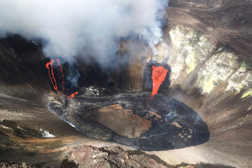 A plume rises near active fissures in the crater of Hawaii's Kilauea volcano on Monday, Dec. 21, 2020. (M. Patrick/U.S. Geological Survey via AP)