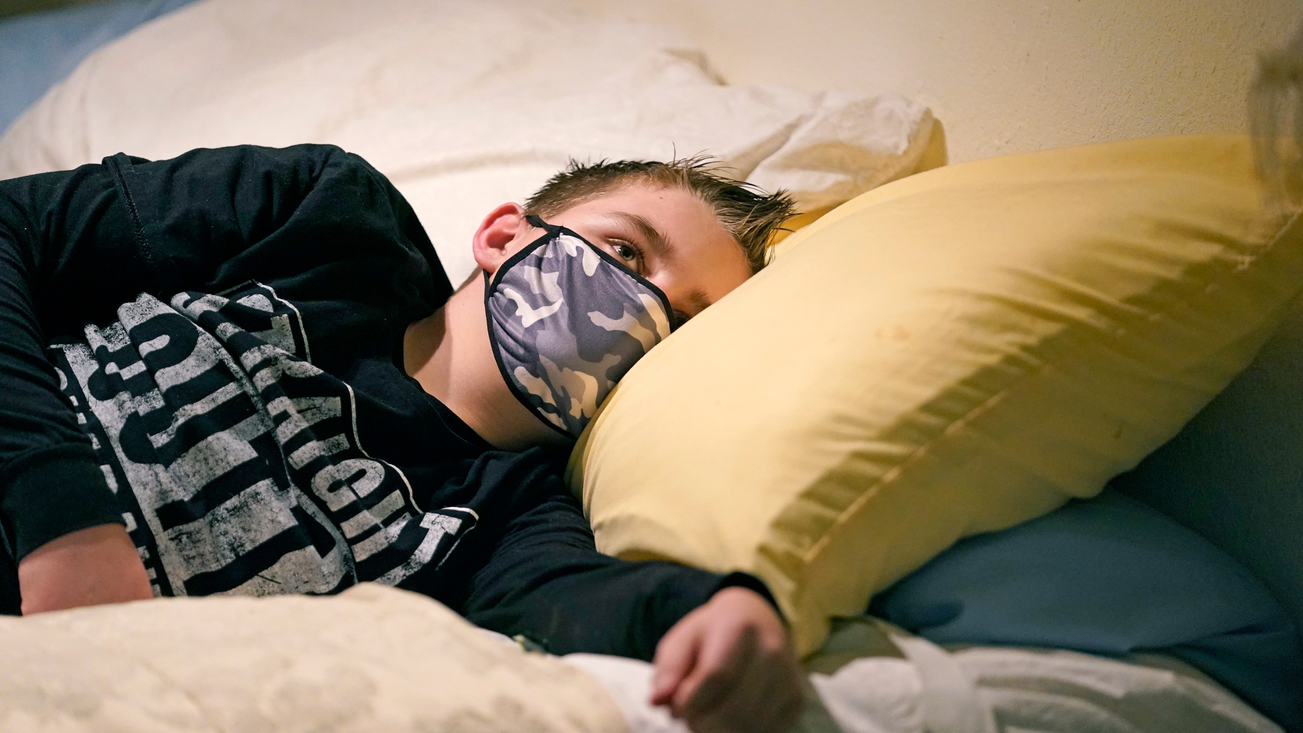 Cooper Wuthrich rests as he lays on a bed at the truck stop his family partly owns Tuesday, Dec. 15, 2020, in Montpelier, Idaho. (Rick Bowmer/AP Photo)