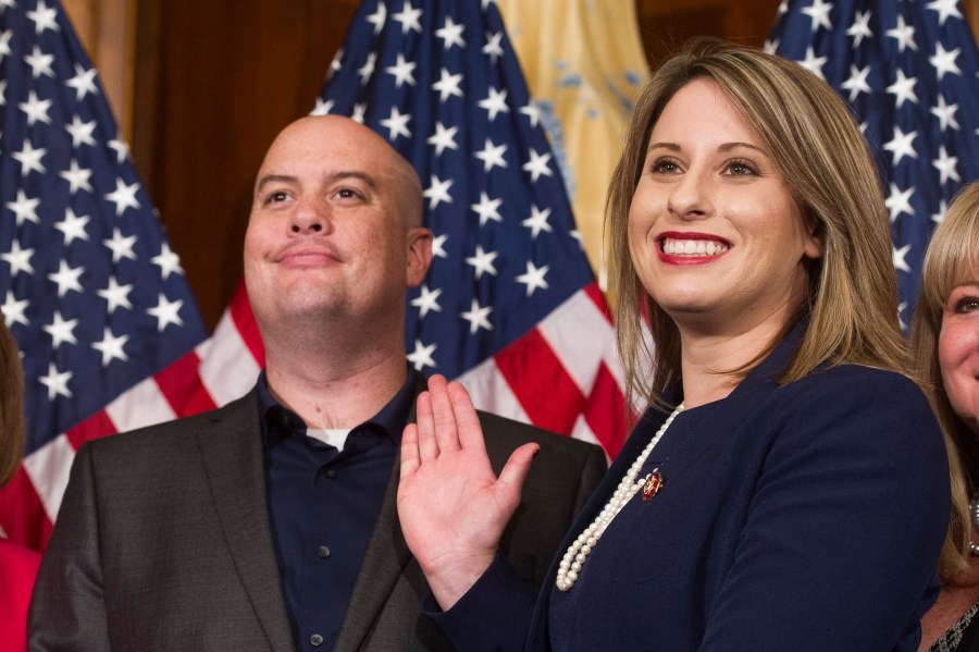 In this Jan. 3, 2019, file photo, Rep. Katie Hill, D-Calif., and Hill's then-husband, Kenneth Heslep, pose during a ceremonial swearing in on Capitol Hill in Washington during the opening session of the 116th Congress. (AP Photo/Cliff Owen, File)