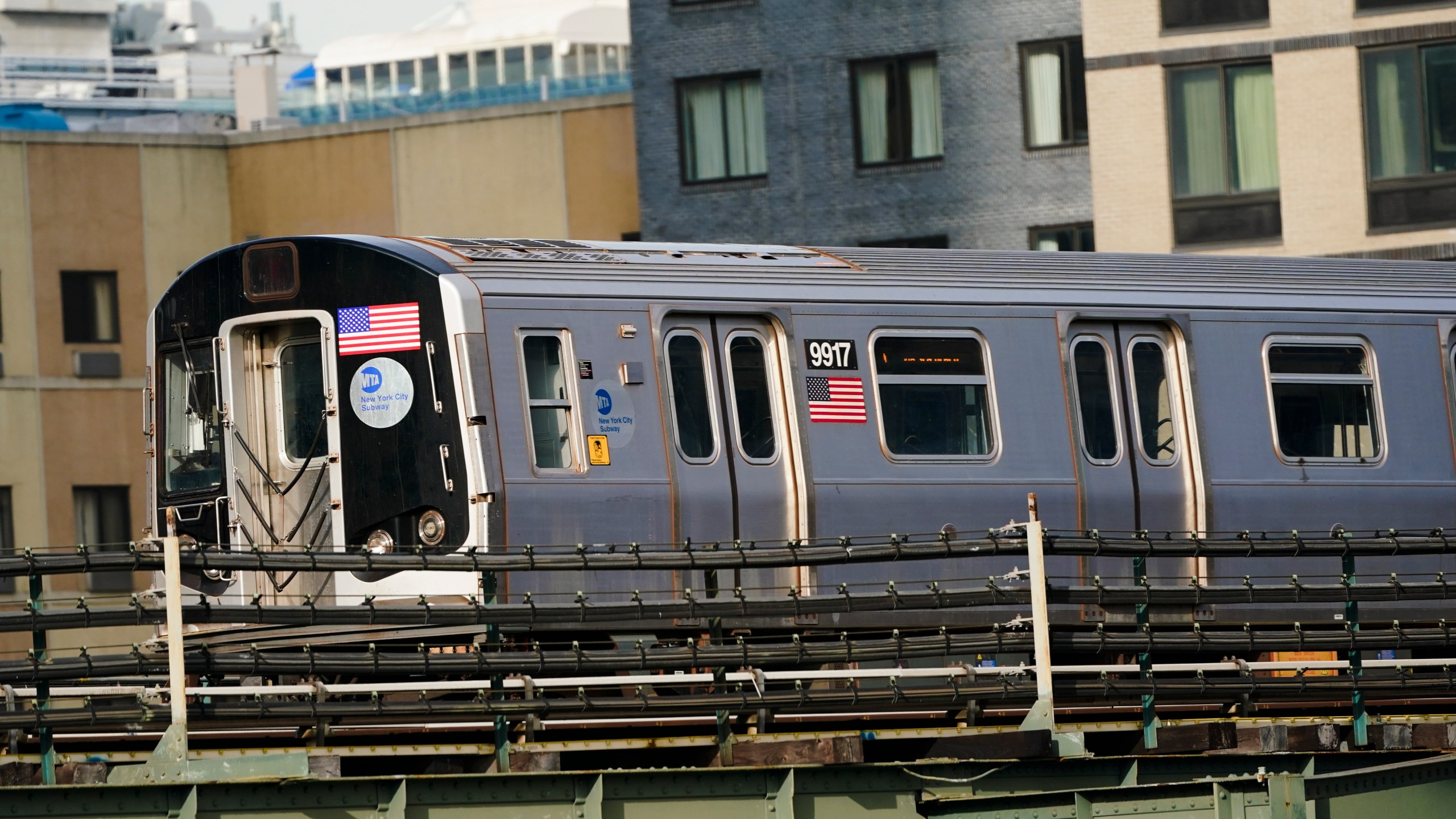 An N train moves through the Long Island City neighborhood Wednesday, Dec. 23, 2020, in the Queens borough of New York. (Frank Franklin II/AP Photo)