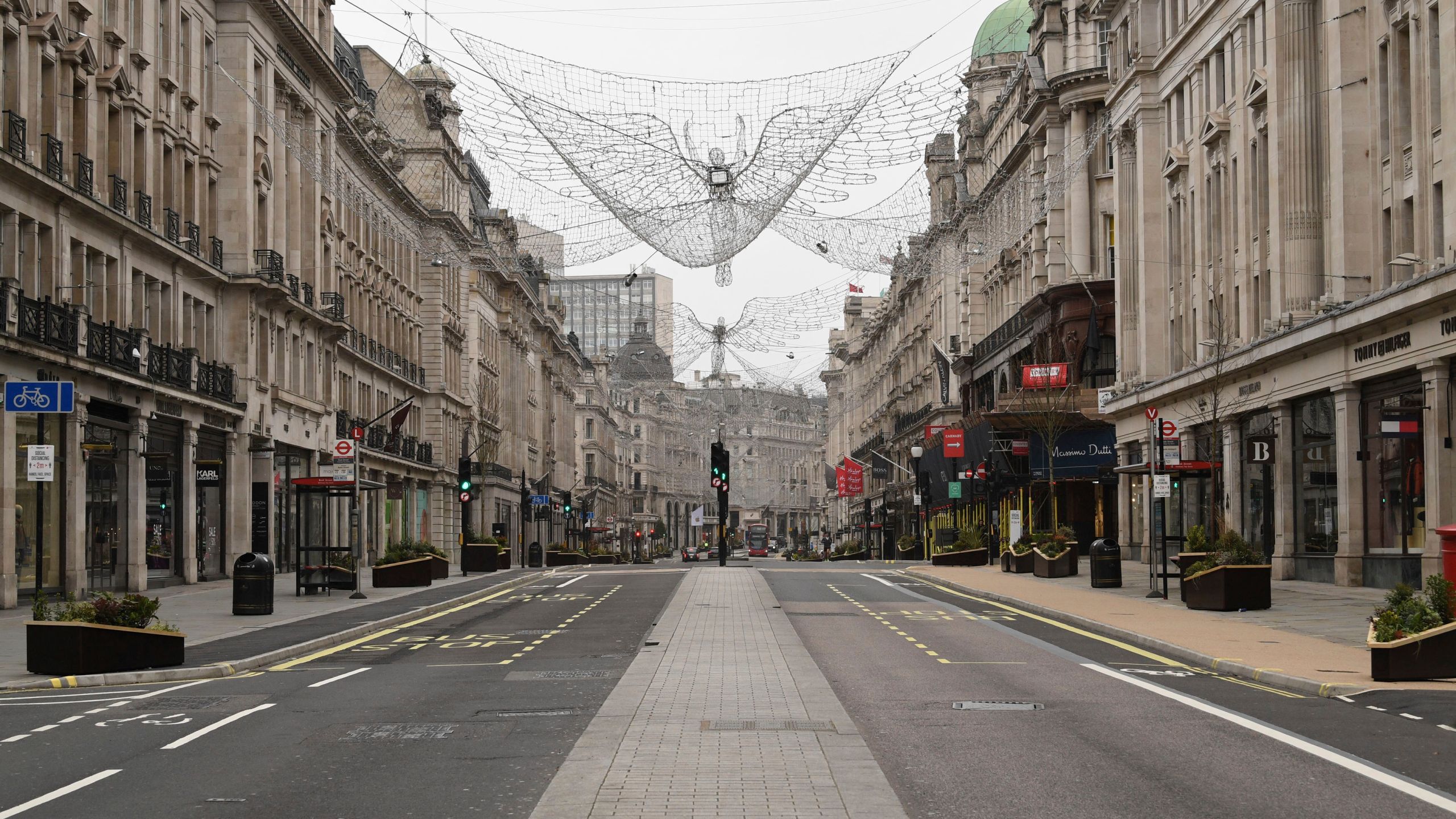 A view of an empty Regent Street, during what would normally be the Boxing Day sales. Boxing Day spending is expected to fall by more than a quarter compared with a year ago, after extensive new COVID-19 restrictions forced non-essential retailers to close, in London, Saturday, Dec. 26, 2020. (Stefan Rousseau/PA via AP)