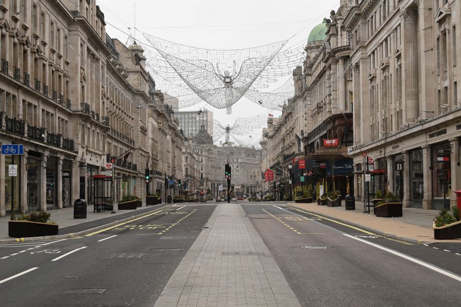 A view of an empty Regent Street, during what would normally be the Boxing Day sales. Boxing Day spending is expected to fall by more than a quarter compared with a year ago, after extensive new COVID-19 restrictions forced non-essential retailers to close, in London, Saturday, Dec. 26, 2020. (Stefan Rousseau/PA via AP)