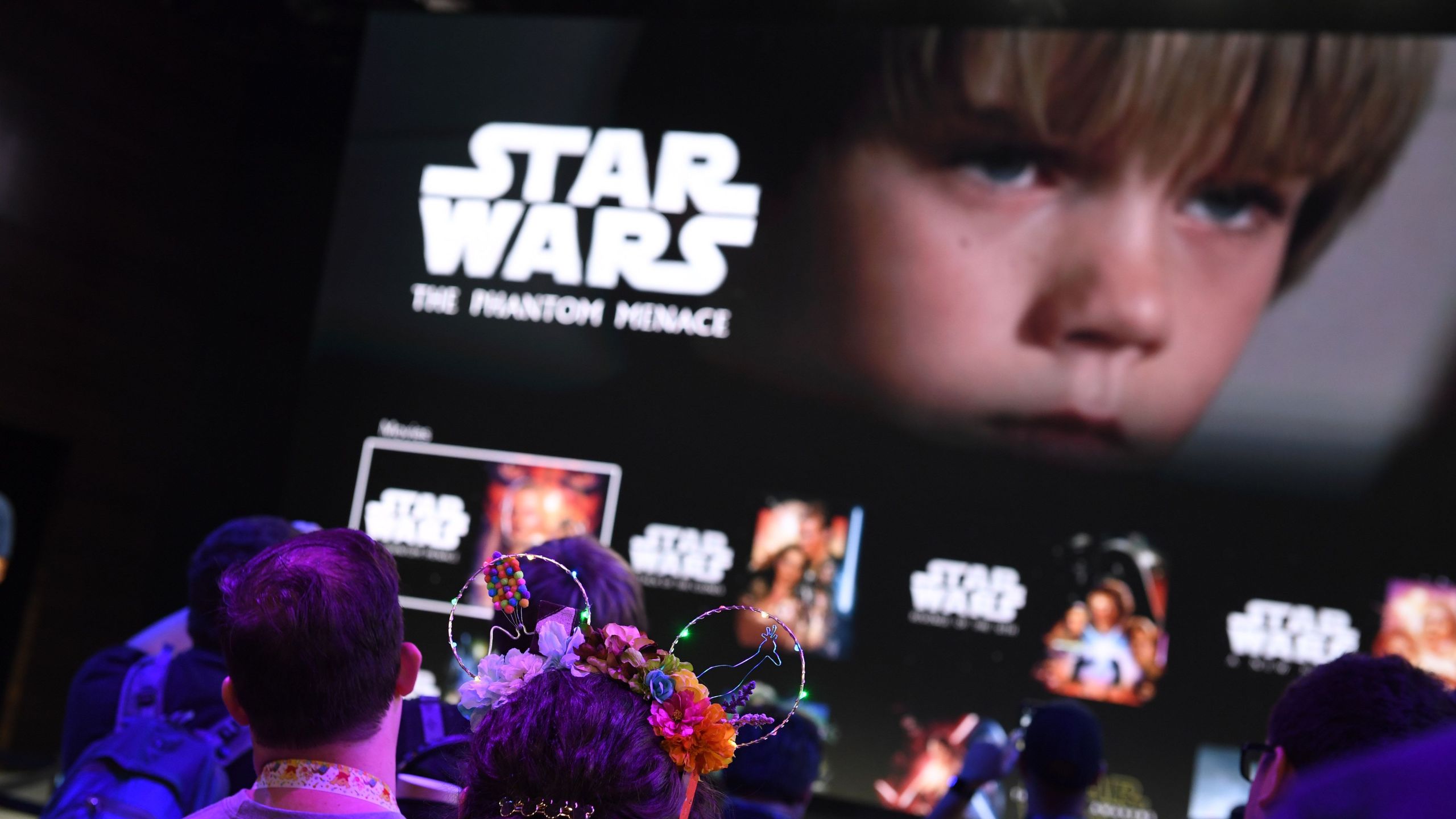 Attendees get a preview of the Disney+ streaming service interface at the D23 Expo on Aug.23, 2019 at the Anaheim Convention Center. (ROBYN BECK/AFP via Getty Images)