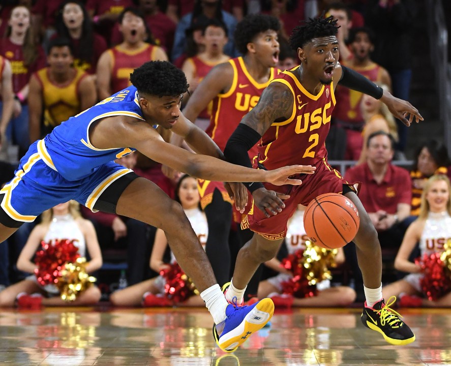 Chris Smith #5 of the UCLA Bruins and Jonah Mathews #2 of the USC Trojans battle for a loose ball in the second half of the game at Galen Center on March 7, 2020 in Los Angeles, California. (Jayne Kamin-Oncea/Getty Images)