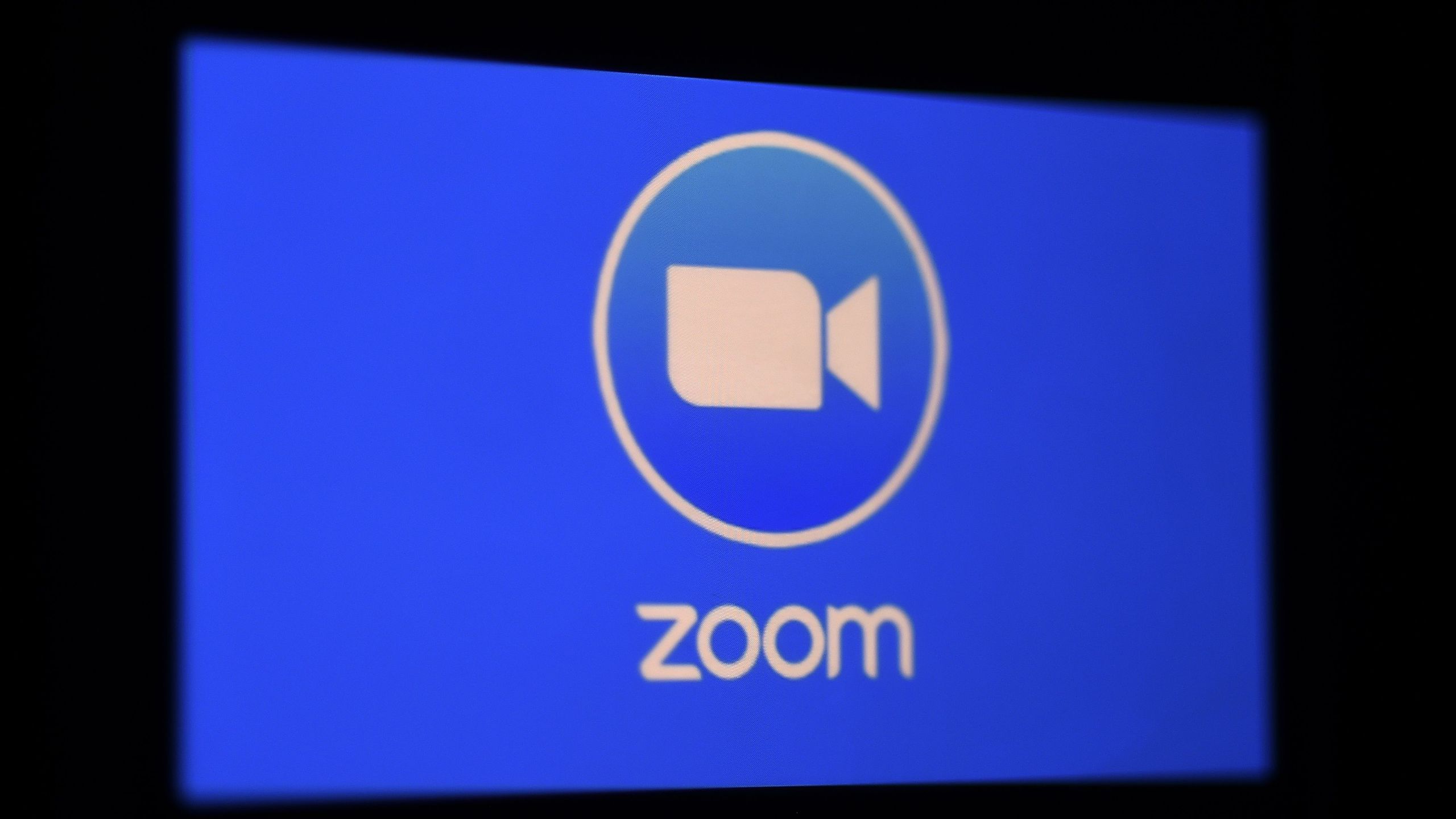 In this photo illustration a Zoom App logo is displayed on a smartphone on March 30, 2020, in Arlington, Virginia. (Olivier Douliery / AFP / Getty Images)