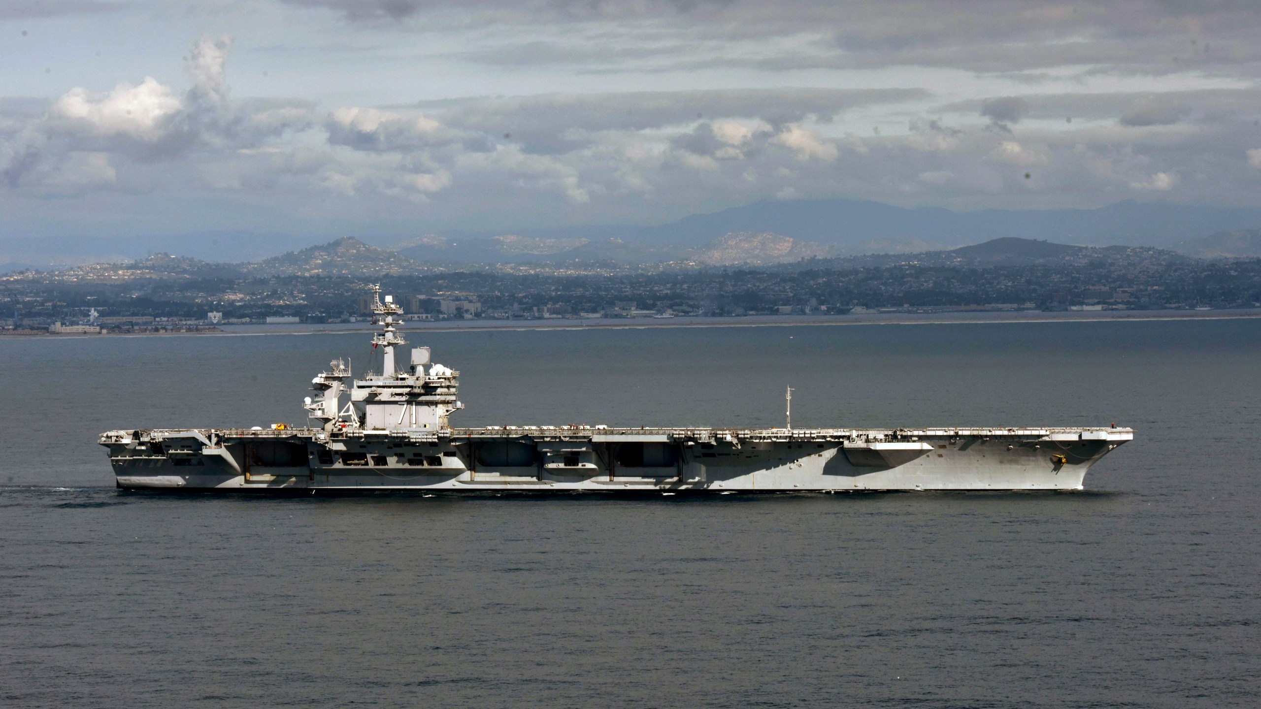 In this handout released by the U.S. Navy, The aircraft carrier USS Theodore Roosevelt leaves its San Diego homeport Jan. 17, 2020. (U.S. Navy via Getty Images)