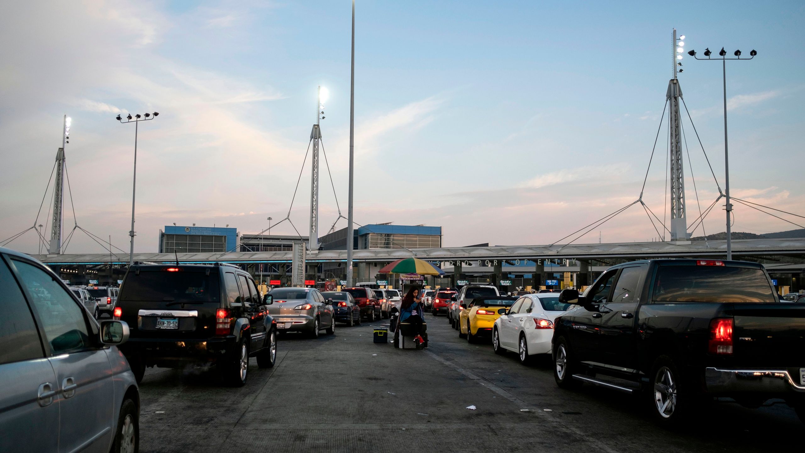 Cars line up to cross the U.S./Mexico border to San Diego at San Ysidro port of entry, in Tijuana, Baja California state, Mexico, on Oct. 6, 2020. (GUILLERMO ARIAS/AFP via Getty Images)