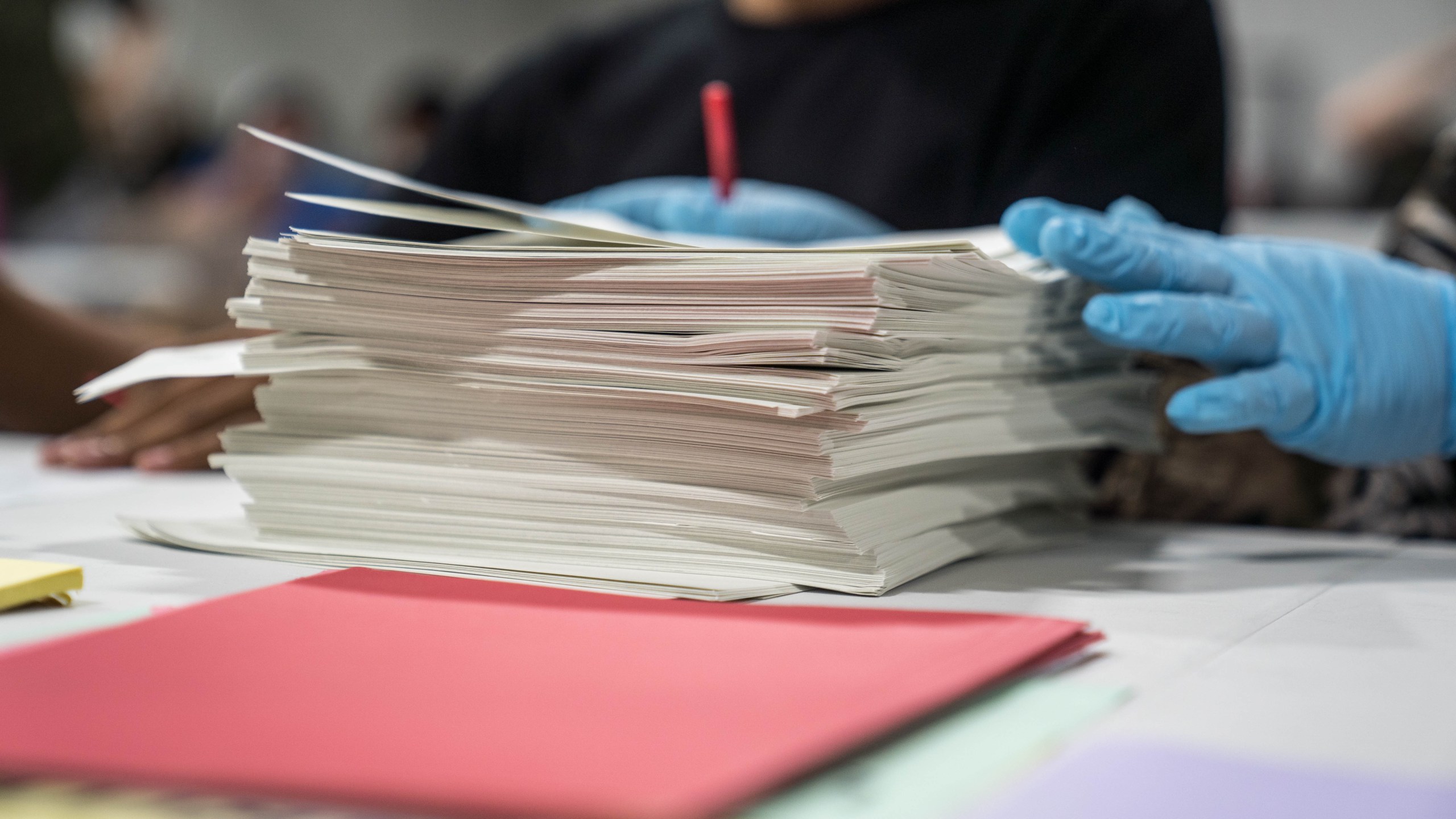 Gwinnett County election workers handle ballots as part of the recount for the 2020 presidential election at the Beauty P. Baldwin Voter Registrations and Elections Building on November 16, 2020 in Lawrenceville, Georgia. (Megan Varner/Getty Images)