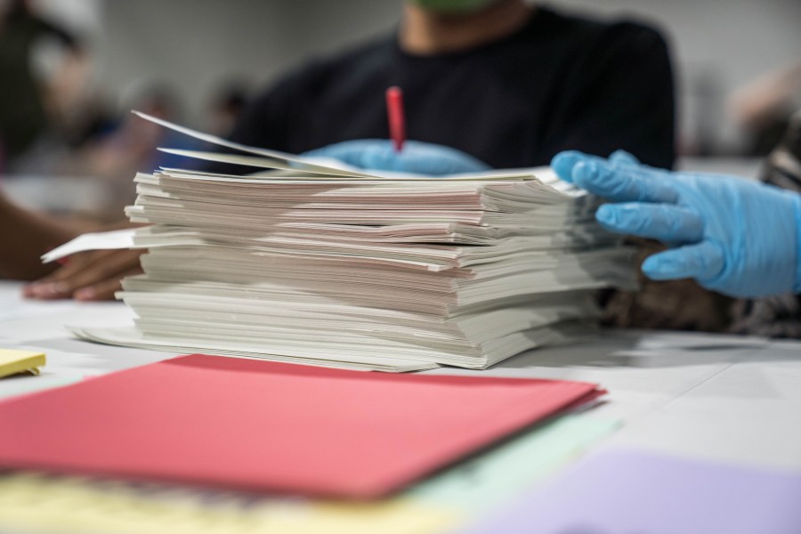 Gwinnett County election workers handle ballots as part of the recount for the 2020 presidential election at the Beauty P. Baldwin Voter Registrations and Elections Building on November 16, 2020 in Lawrenceville, Georgia. (Megan Varner/Getty Images)