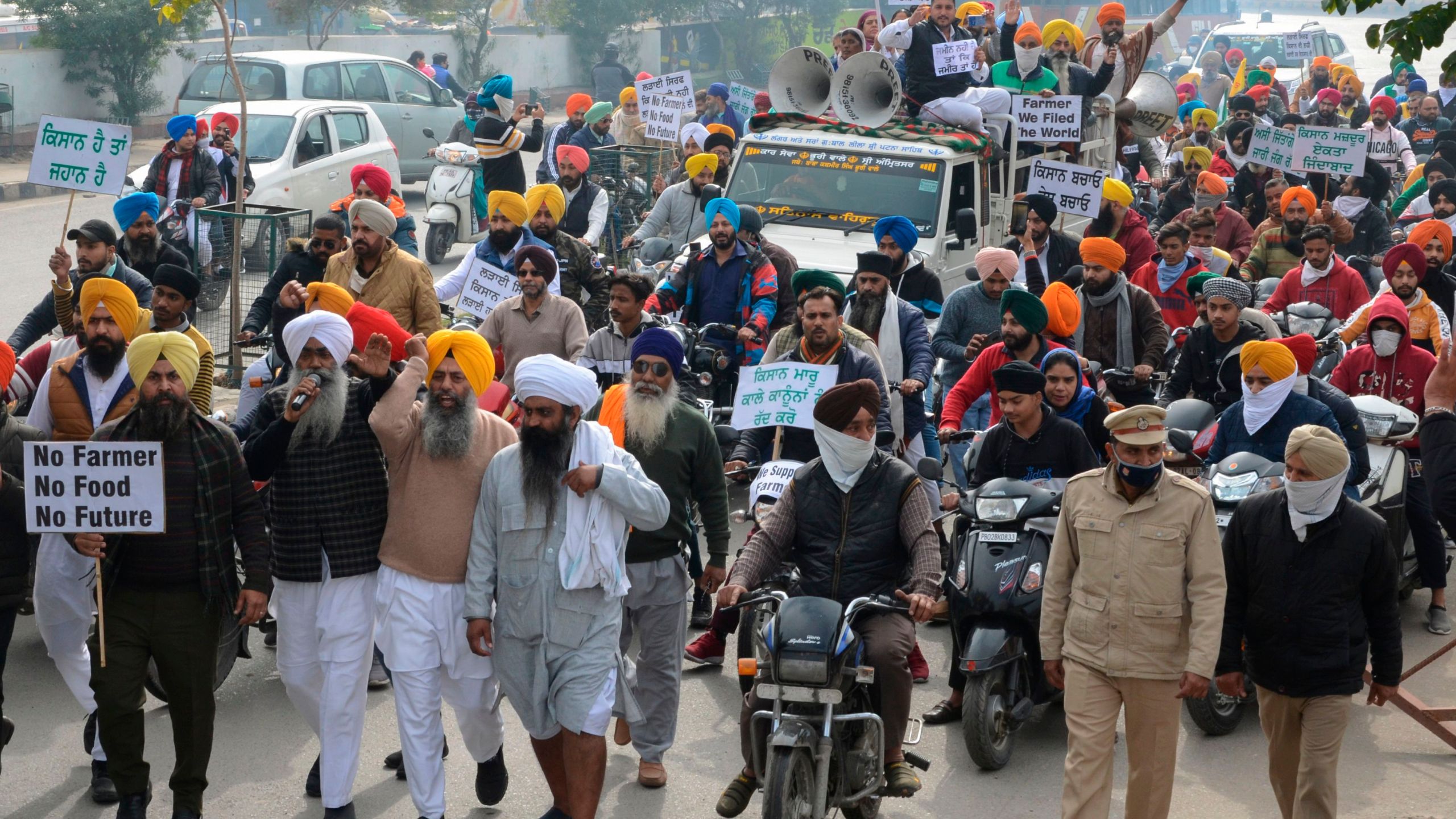 Protesters hold placards and shout slogans against Indian Prime Minister Narendra Modi during a protest rally in support of farmers against the recent agricultural reforms, in Amritsar on December 13, 2020. (Narinder Nanu/AFP via Getty Images)