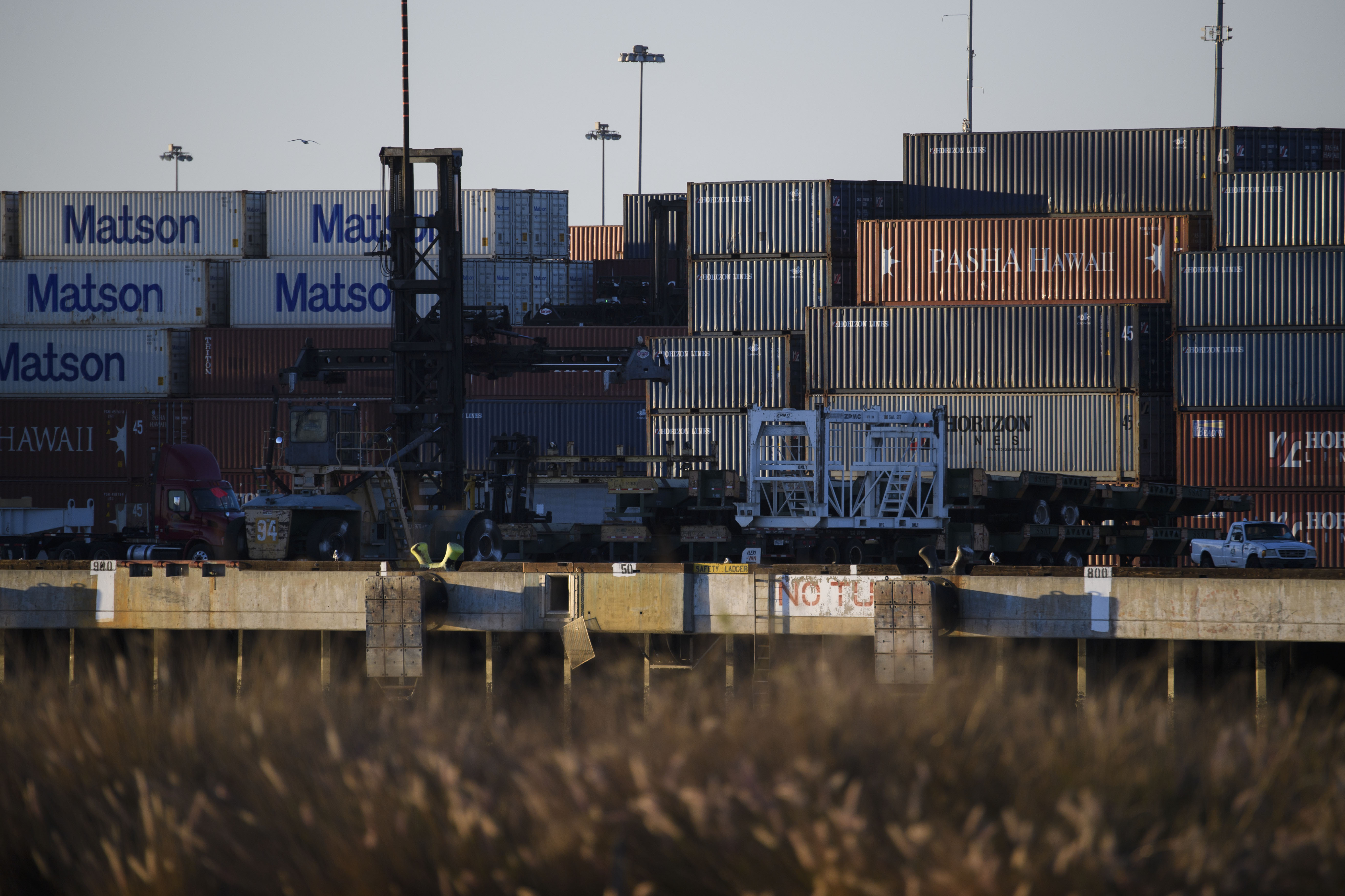 Cargo shipping containers in the Port of Long Beach on December 14, 2020 in Long Beach, California. - The bridge's higher clearance accommodates larger cargo ships, linking the international and domestic shipping of goods and materials at the port complex. (Patrick T. Fallon/AFP via Getty Images)