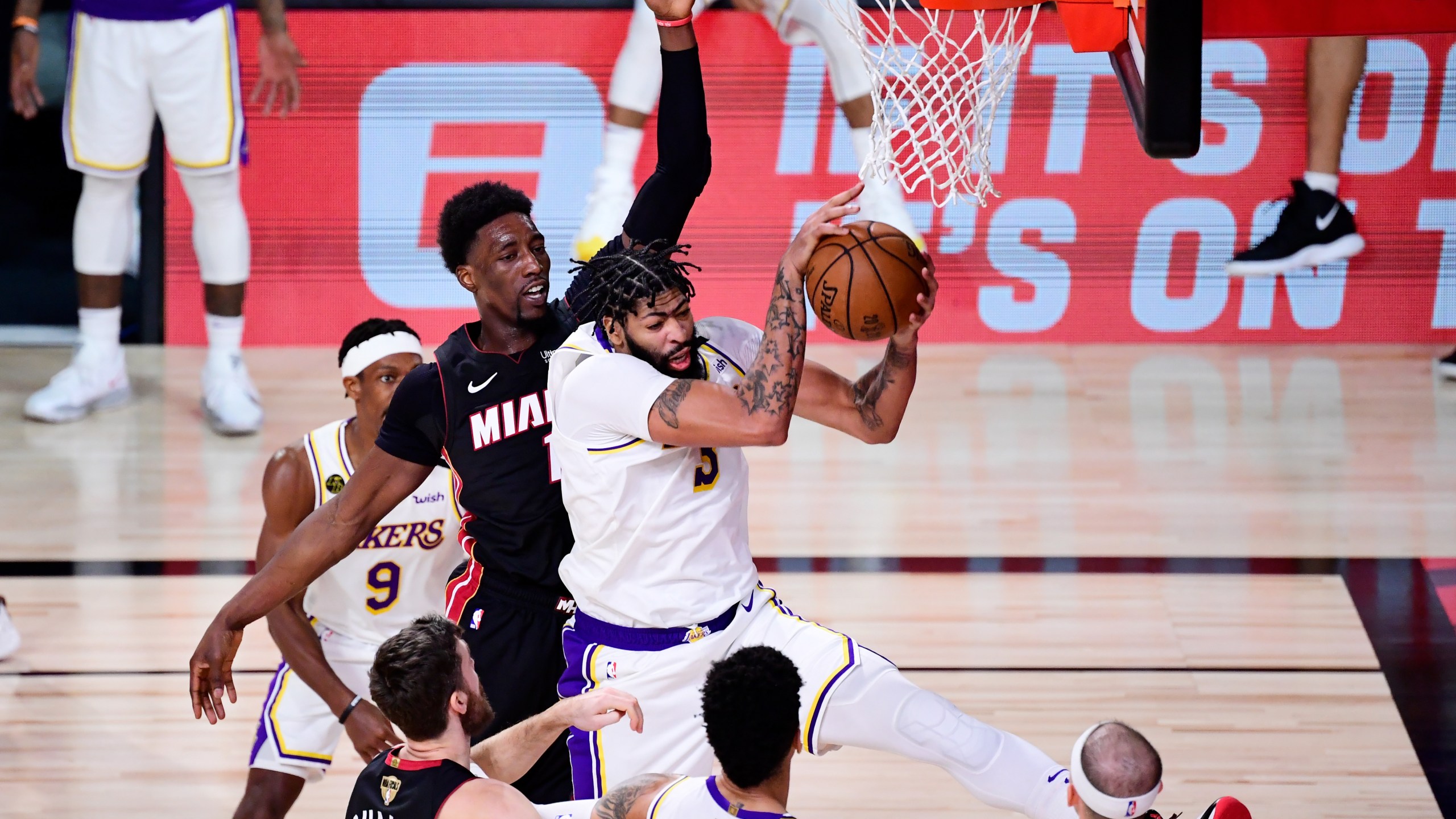 Anthony Davis #3 of the Los Angeles Lakers rebounds the ball against Bam Adebayo #13 of the Miami Heat during the fourth quarter in Game Six of the 2020 NBA Finals at AdventHealth Arena at the ESPN Wide World Of Sports Complex on Oct. 11, 2020 in Lake Buena Vista, Florida. (Douglas P. DeFelice/Getty Images)