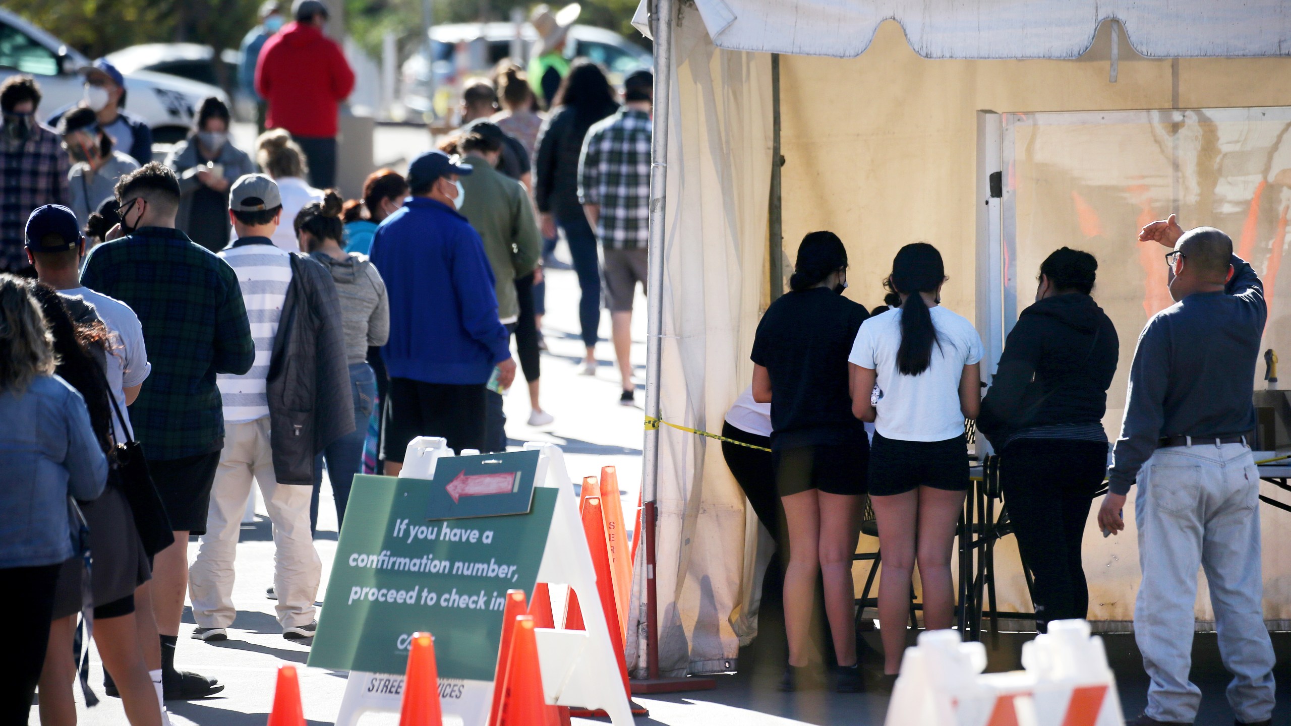 People wait in line for COVID-19 testing at Lincoln Park on the Monday after Thanksgiving weekend on Nov. 30, 2020. (Mario Tama / Getty Images)