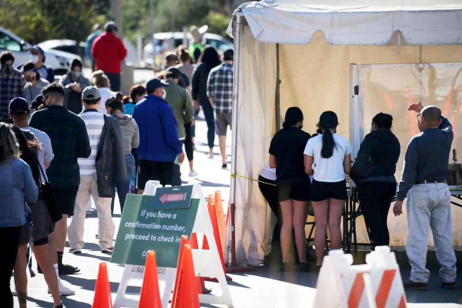 People wait in line for COVID-19 testing at Lincoln Park on the Monday after Thanksgiving weekend on Nov. 30, 2020. (Mario Tama / Getty Images)