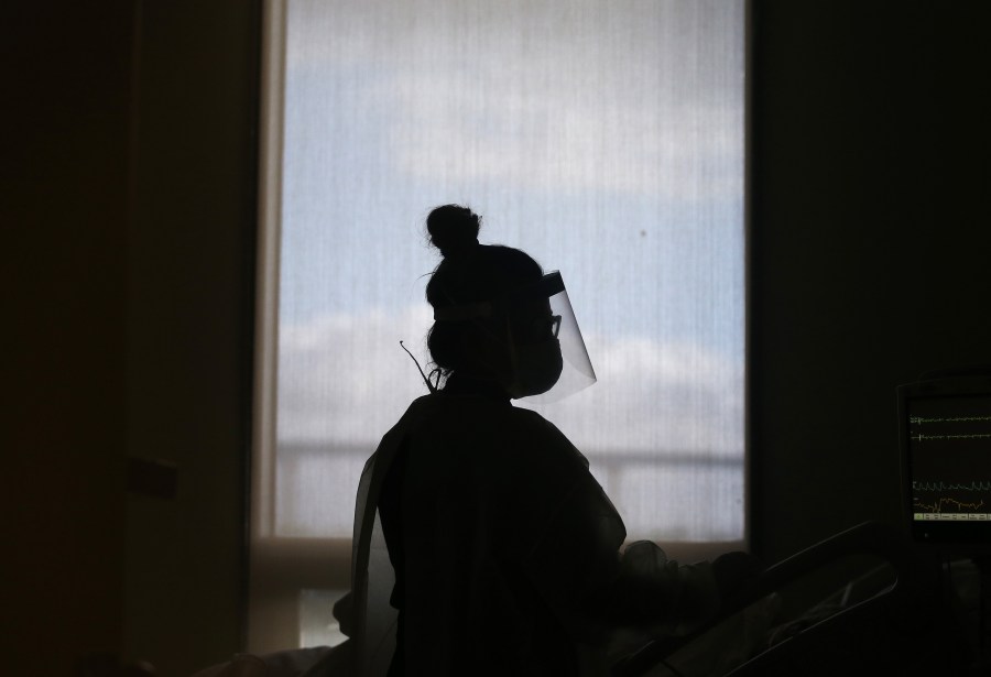 Registered nurse Priscilla Sepulveda cares for a COVID-19 patient in the COVID unit at Sharp Coronado Hospital on December 14, 2020 in Coronado, California. (Mario Tama/Getty Images)