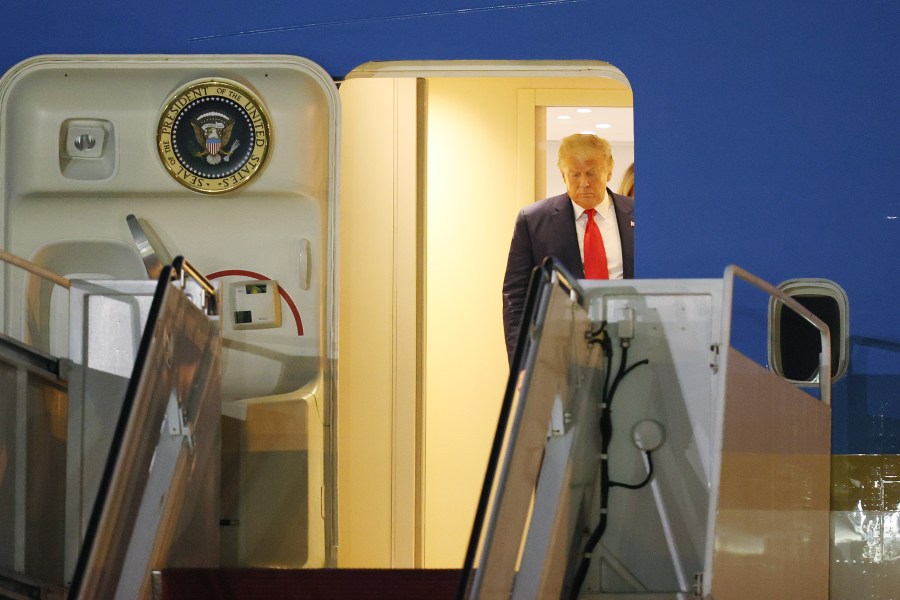 Donald Trump prepares to exit from Air Force One at the Palm Beach International Airport on Dec. 23, 2020 in West Palm Beach, Florida. (Joe Raedle/Getty Images)