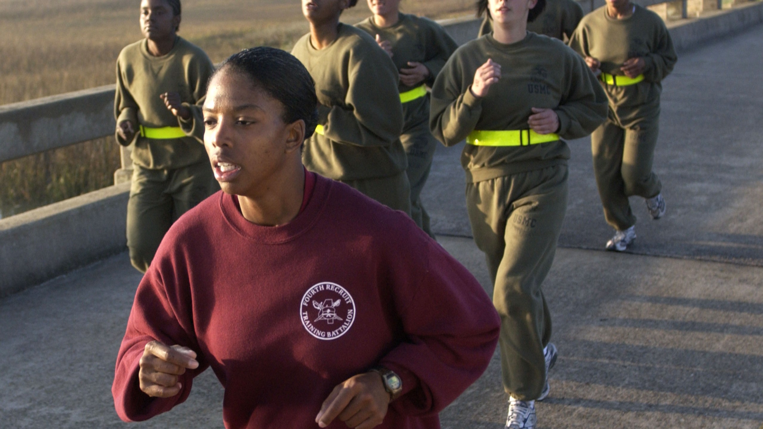 In this file photo, U.S. Marine Corps Drill Instructor Sgt. Subrina Dickerson leads a small pack of female recruits during run a three mile run during a physcial training test Feb. 19, 2003, at the Marine Corps Recruit Depot in Parris Island, South Carolina. (Stephen Morton/Getty Images)