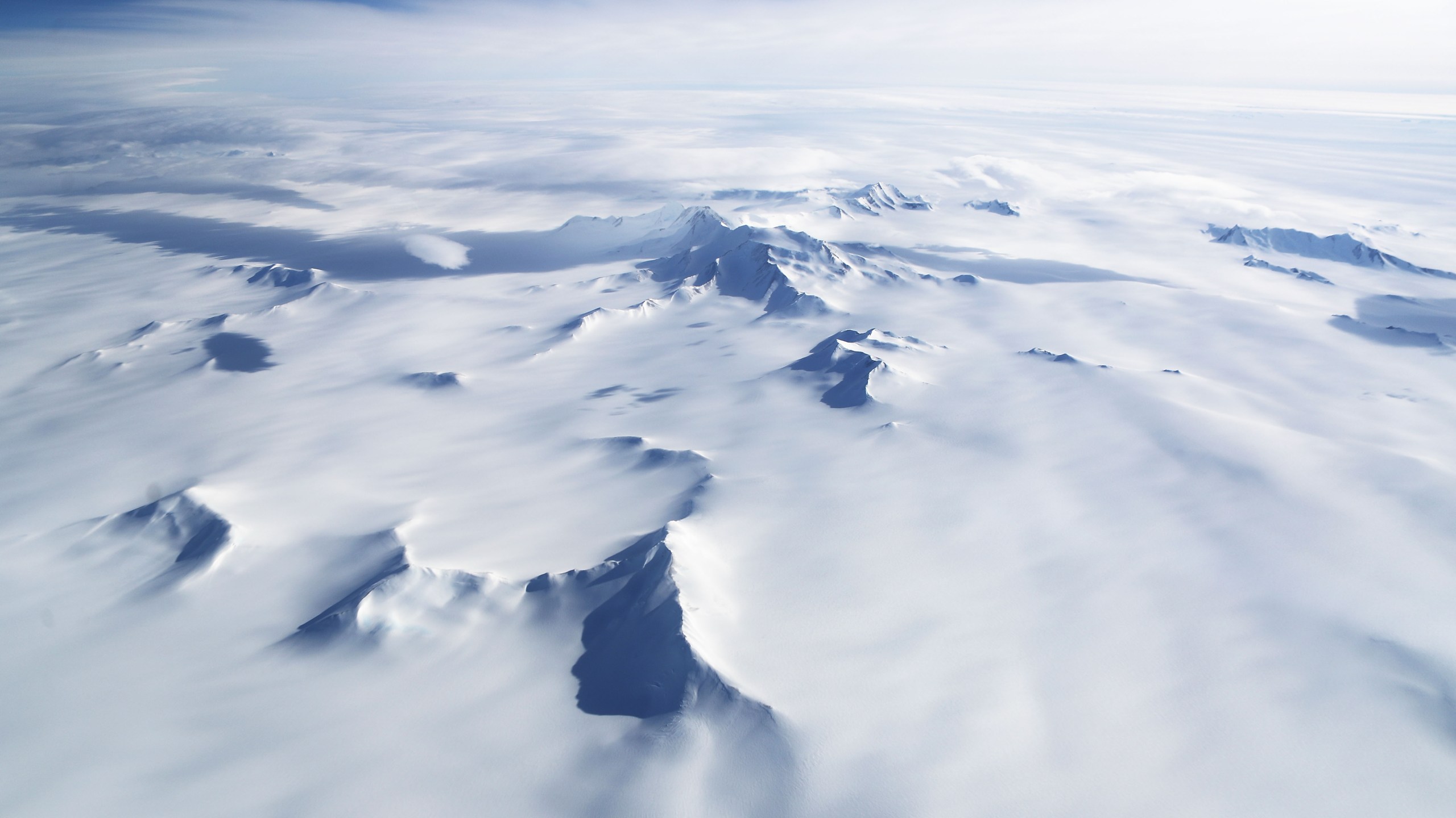 Mountains and land ice are seen from NASA's Operation IceBridge research aircraft in the Antarctic Peninsula region, on November 4, 2017, above Antarctica. (Mario Tama/Getty Images)