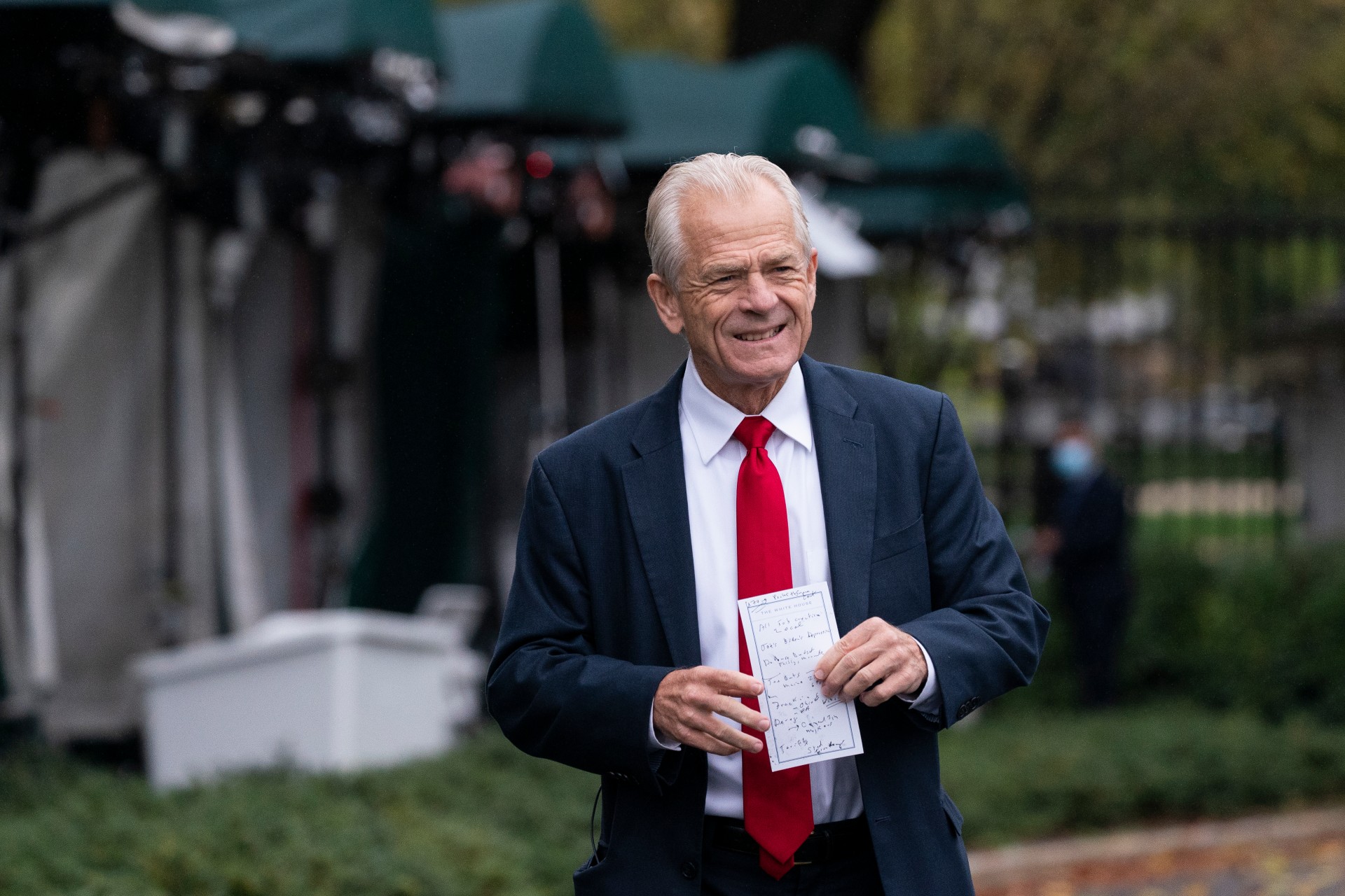 White House trade adviser Peter Navarro holds his notes after a television interview at the White House Monday, Oct. 12, 2020, in Washington. (AP Photo/Alex Brandon)