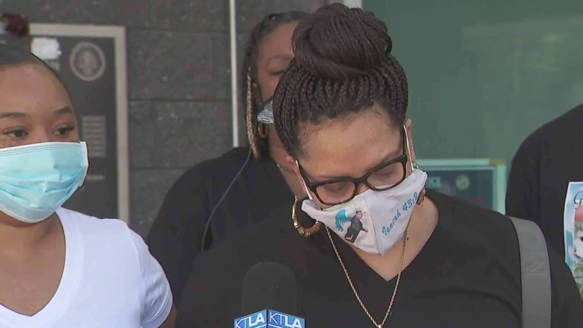 Cortlyn Bridges, center, is comforted by Brittney Braddock during a news conference on Dec. 9, 2020 about the fatally shooting of Ky Thomas. (KTLA)