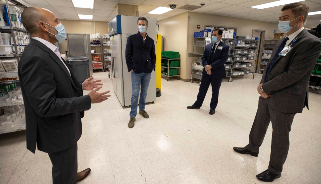 Gov. Gavin Newsom on Dec. 11, 2020 tours a facility preparing to receive COVID-19 vaccines at UC Davis. (California governor's office)