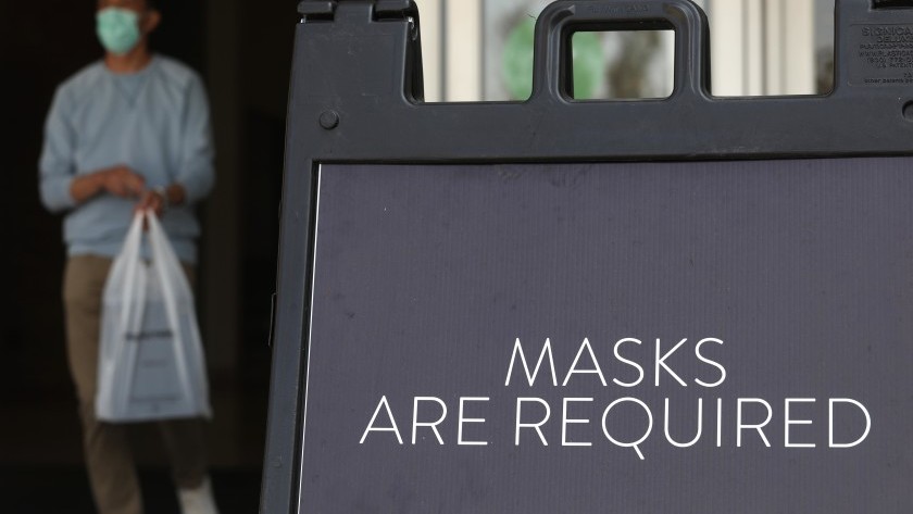 A sign reminding customers to wear mask in L.A. County is seen in a file photo. (Genaro Molina / Los Angeles Times)