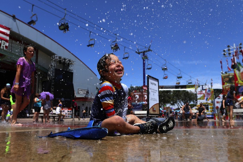 Mason Rose plays in a splash zone at the Orange County Fair in Costa Mesa in 2019. (Gary Coronado / Los Angeles Times)