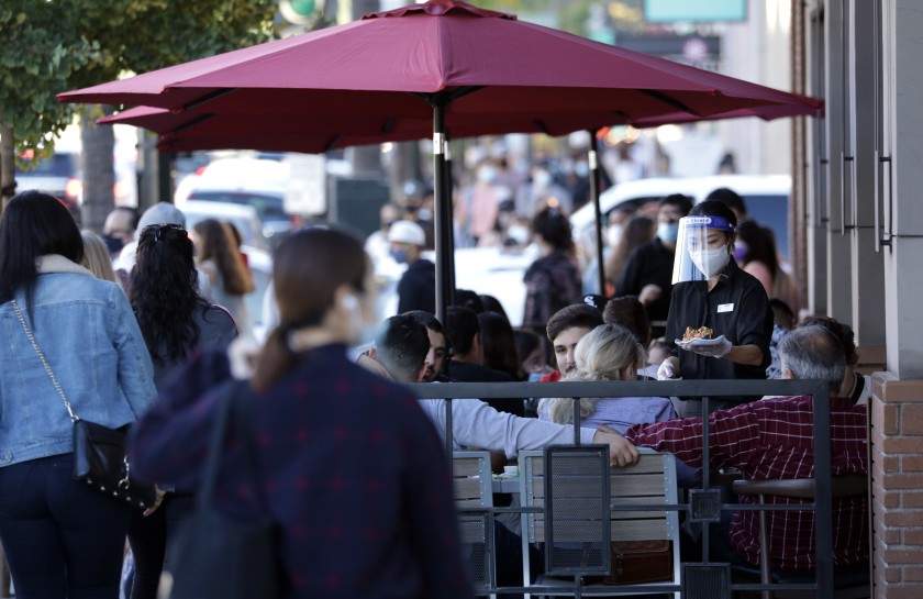 Outdoor dining along Colorado Boulevard in Pasadena is shown in late November 2020. (Myung J. Chun/ Los Angeles Times)