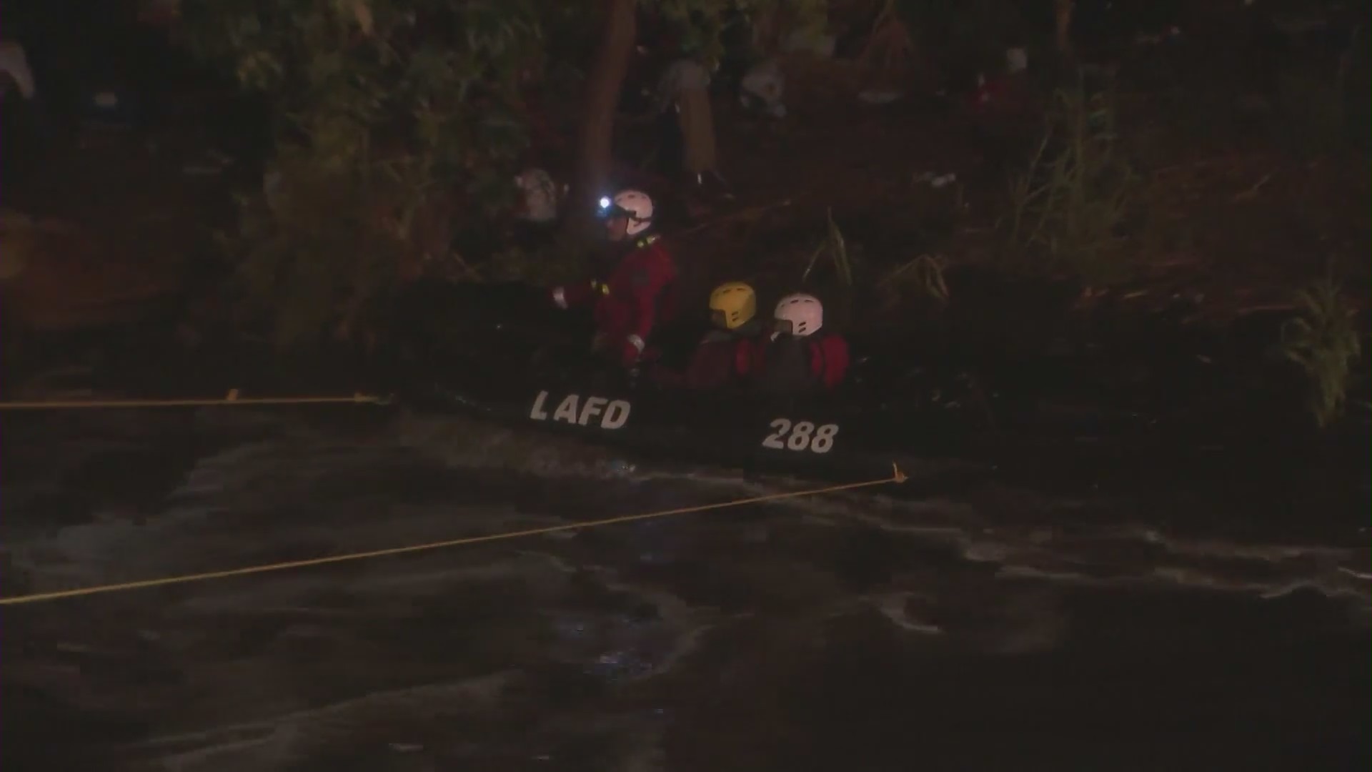 A swift water rescue team is called to the Los Angeles river to assist a stranded man and woman on Dec. 28, 2020. (KTLA)