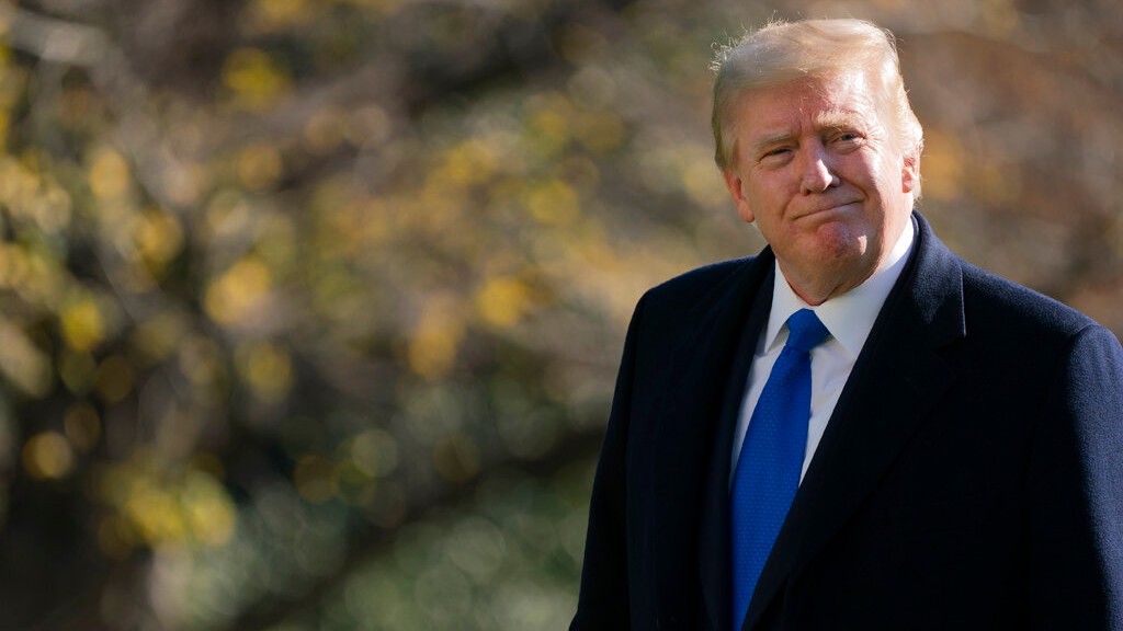 President Donald Trump walks on the South Lawn of the White House in Washington, Sunday, Nov. 29, 2020, after stepping off Marine One. (AP Photo/Patrick Semansky)